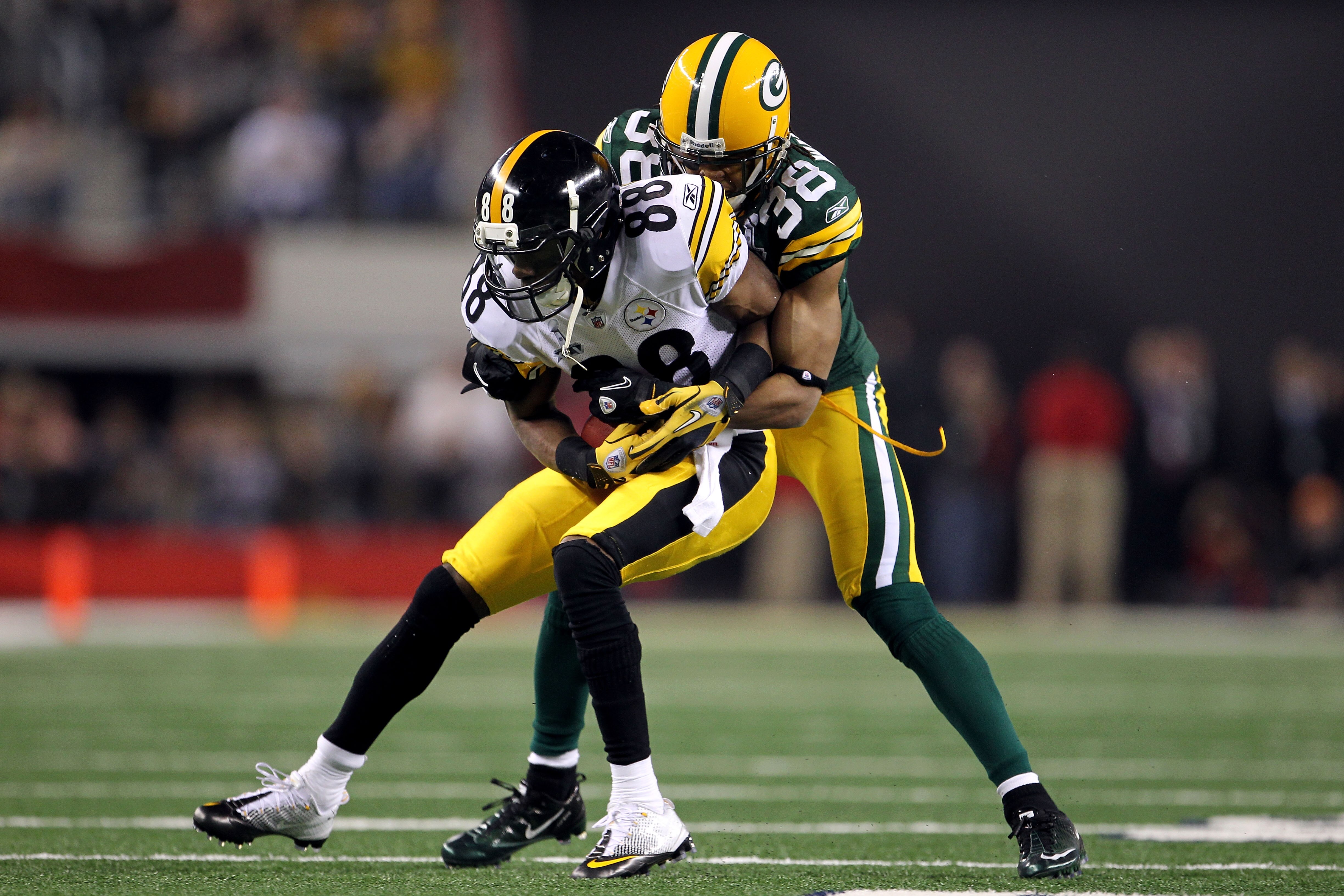 ARLINGTON, TX - FEBRUARY 06: Emmanuel Sanders #88 of the Pittsburgh Steelers makes a reception against Tramon Williams #38 of the Green Bay Packers during Super Bowl XLV at Cowboys Stadium on February 6, 2011 in Arlington, Texas. The Packers won 31-25. ( ARLINGTON, TX - FEBRUARY 06: Emmanuel Sanders #88 of the Pittsburgh Steelers makes a reception against Tramon Williams #38 of the Green Bay Packers during Super Bowl XLV at Cowboys Stadium on February 6, 2011 in Arlington, Texas. The Packers won 31-25. (
