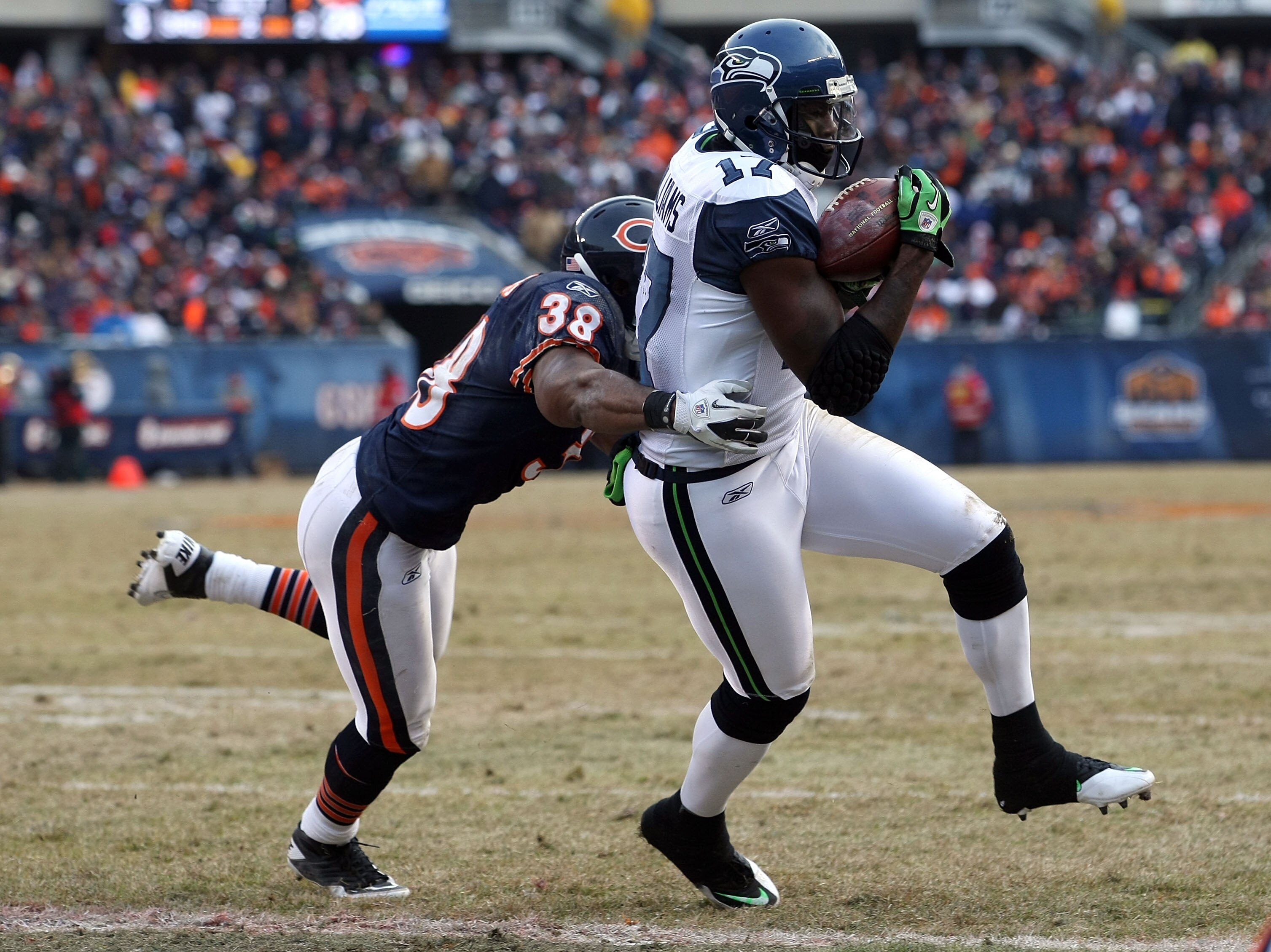 CHICAGO, IL - JANUARY 16: Wide receiver Mike Williams #17 of the Seattle Seahawks catches a two-yard touchdown against Danieal Manning #38 of the Chicago Bears in the fourth quarter of the 2011 NFC divisional playoff game at Soldier Field on January 16, CHICAGO, IL - JANUARY 16: Wide receiver Mike Williams #17 of the Seattle Seahawks catches a two-yard touchdown against Danieal Manning #38 of the Chicago Bears in the fourth quarter of the 2011 NFC divisional playoff game at Soldier Field on January 16,