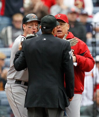 ATLANTA, GA - MAY 17:  Matt Downs #16 and manager Brad Mills of the Houston Astros argue with homeplate umpire Alfonso Marquez #72 after Downs appeared to be hit by a pitch but it was ruled a foul ball in the 11th inning against the Atlanta Braves at Turn