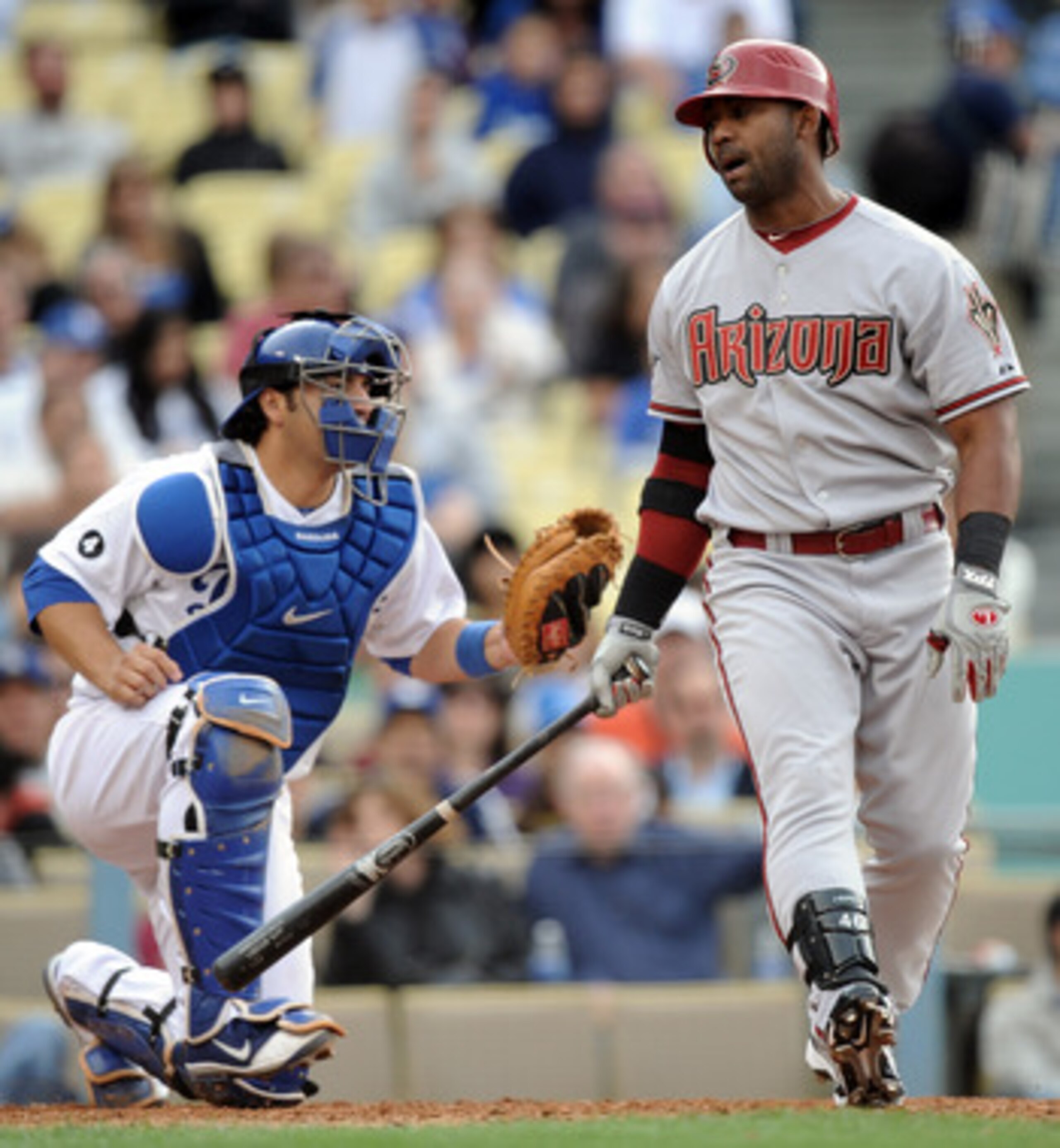 LOS ANGELES, CA - MAY 14:  Juan Miranda #46 of the Arizona Diamondbacks reacts to his strikeout in front of Rod Barajas #28 of the Los Angeles Dodgers at Dodger Stadium on May 14, 2011 in Los Angeles, California.  (Photo by Harry How/Getty Images)