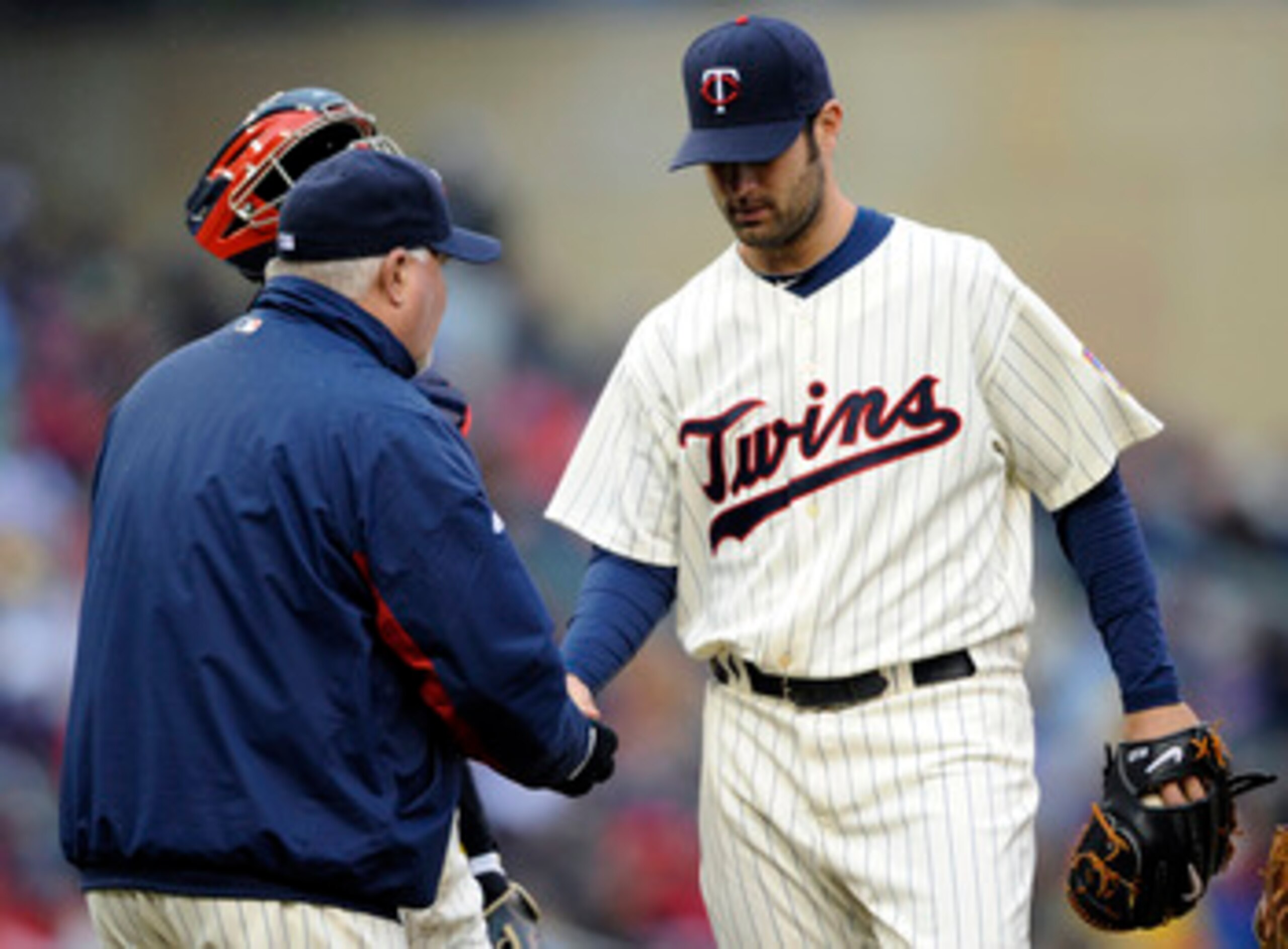 MINNEAPOLIS, MN - MAY 14: Manager Ron Gardenhire #35 of the Minnesota Twins takes starting pitcher Nick Blackburn #53 of the Minnesota Twins out of the game during in the eighth inning on May 14, 2011 at Target Field in Minneapolis, Minnesota. Blue Jays d