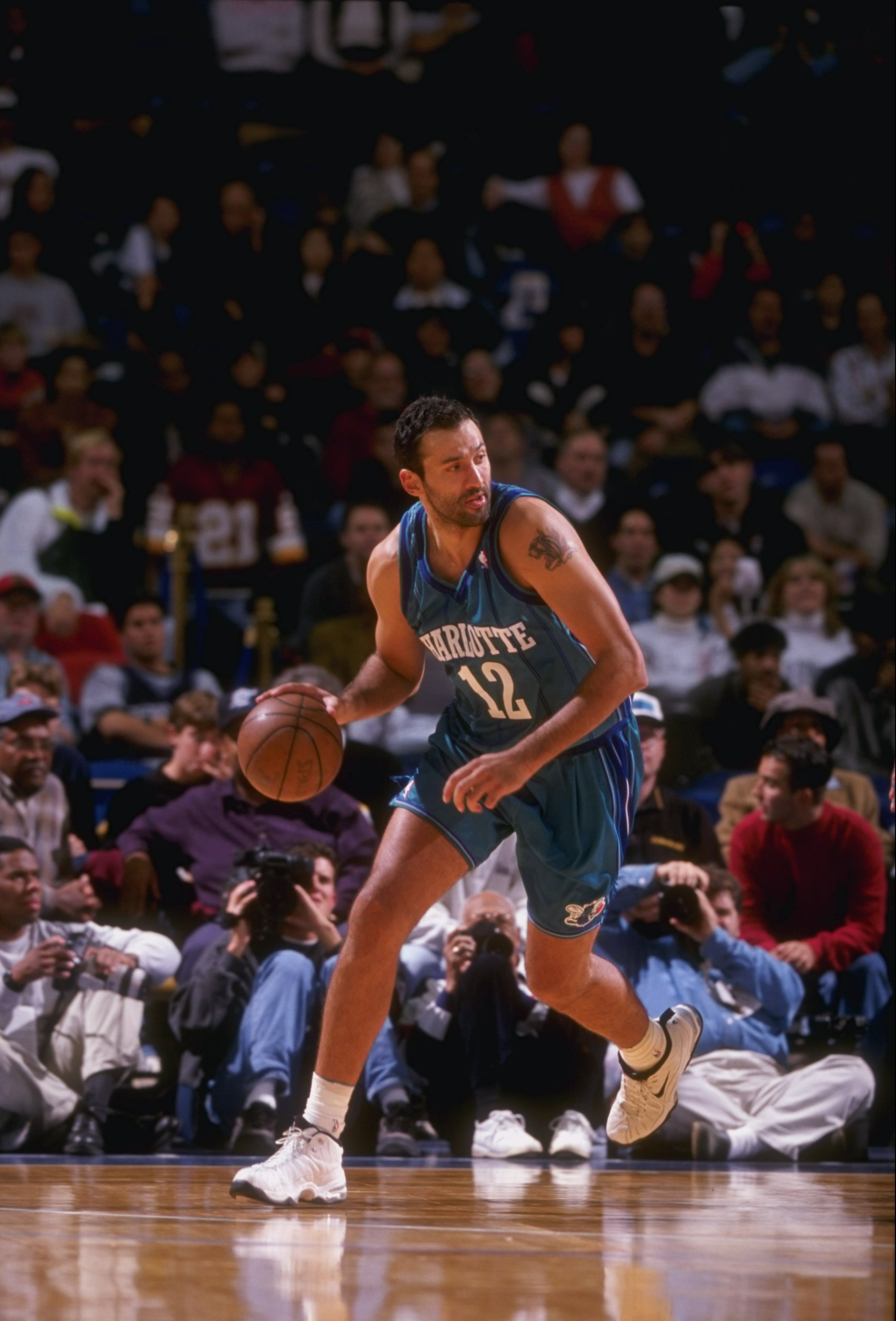 7 Nov 1997:  Center Vlade Divac of the Charlotte Hornets moves the ball during a game against the Washington Wizards at the MCI Center in Washington, D. C.  The Hornets won the game, 107-92. Mandatory Credit: Doug Pensinger  /Allsport