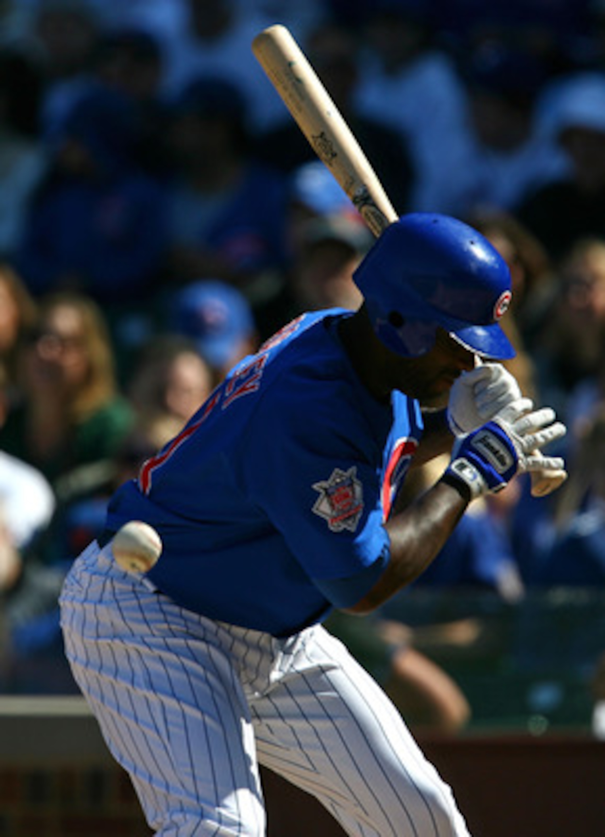 CHICAGO - AUGUST 30: Milton Bradley #21 of the Chicago Cubs is hit by a pitch from Nelson Figueroa of the New York Mets in the 5th inning on August 30, 2009 at Wrigley Field in Chicago, Illinois. (Photo by Jonathan Daniel/Getty Images)