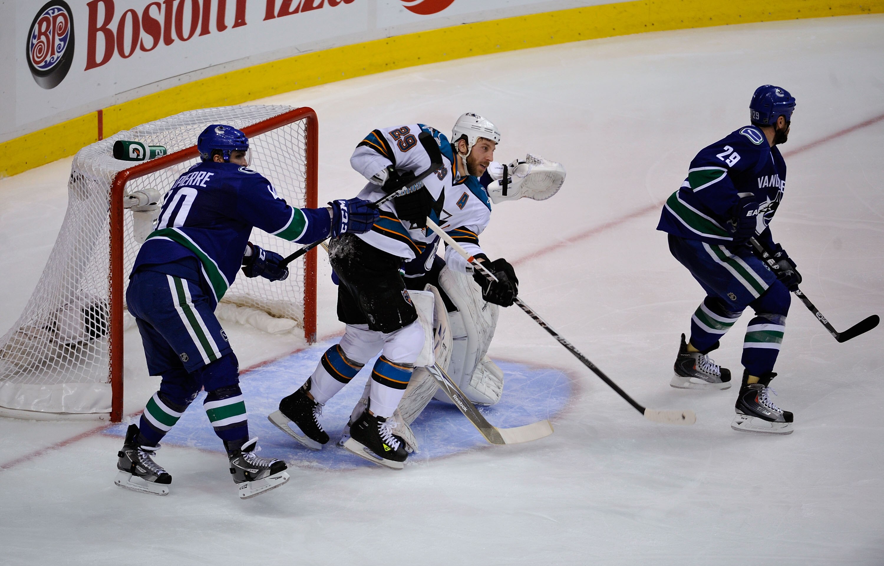 VANCOUVER, CANADA - MAY 15:  Ryan Clowe #29 of the San Jose Sharks and Maxim Lapierre #40 of the Vancouver Canucks vie for position in the crease area in Game One of the Western Conference Finals during the 2011 Stanley Cup Playoffs at Rogers Arena on May