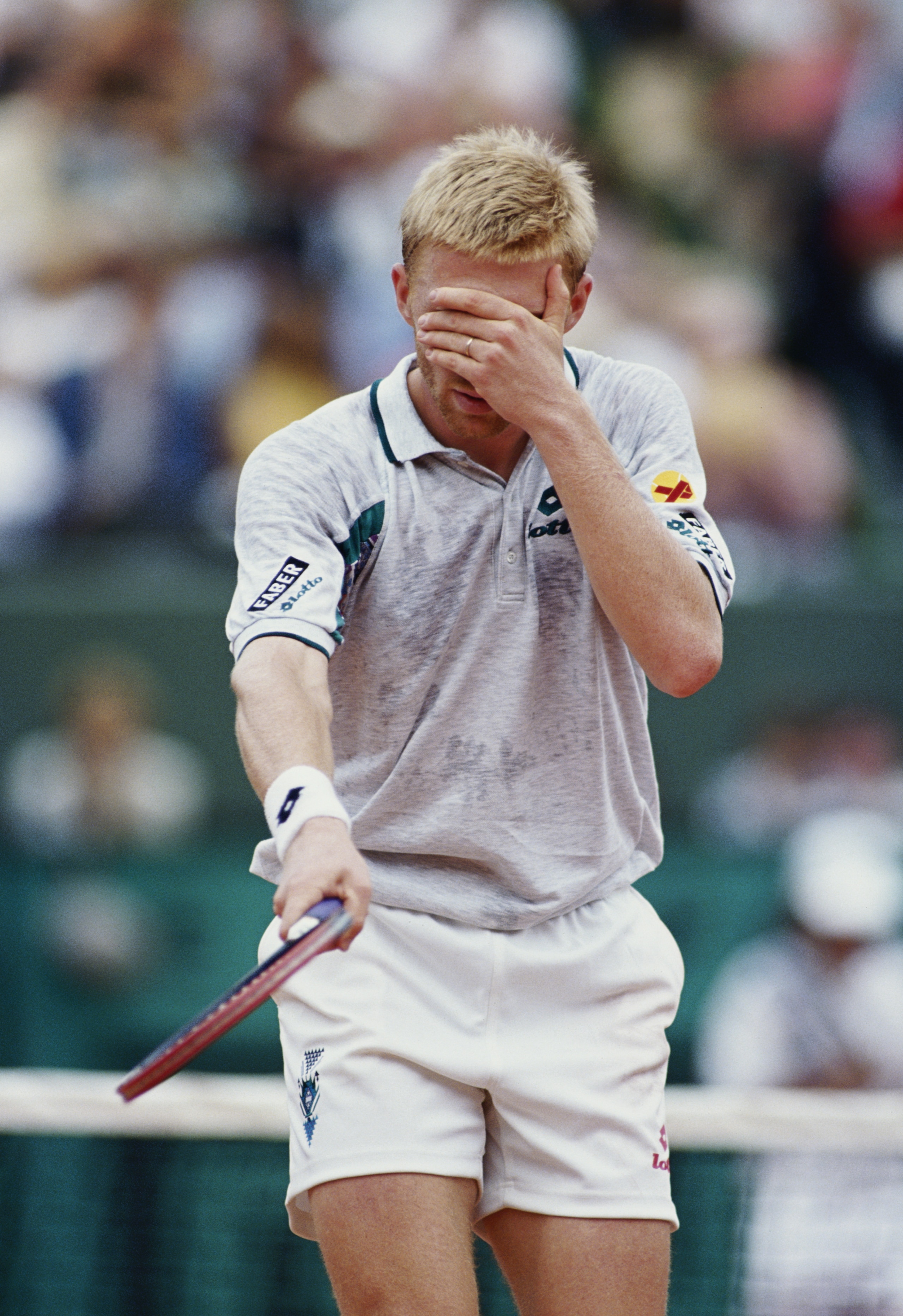 Boris Becker of Germany plays to the crowd by pretending to be blind during the Men's Singles 2nd round match loss to Rodolphe Gilbert at the French Open Tennis Championship on 24th May 1993 at the Stade Roland Garros Stadium in Paris, France.(Photo by Si