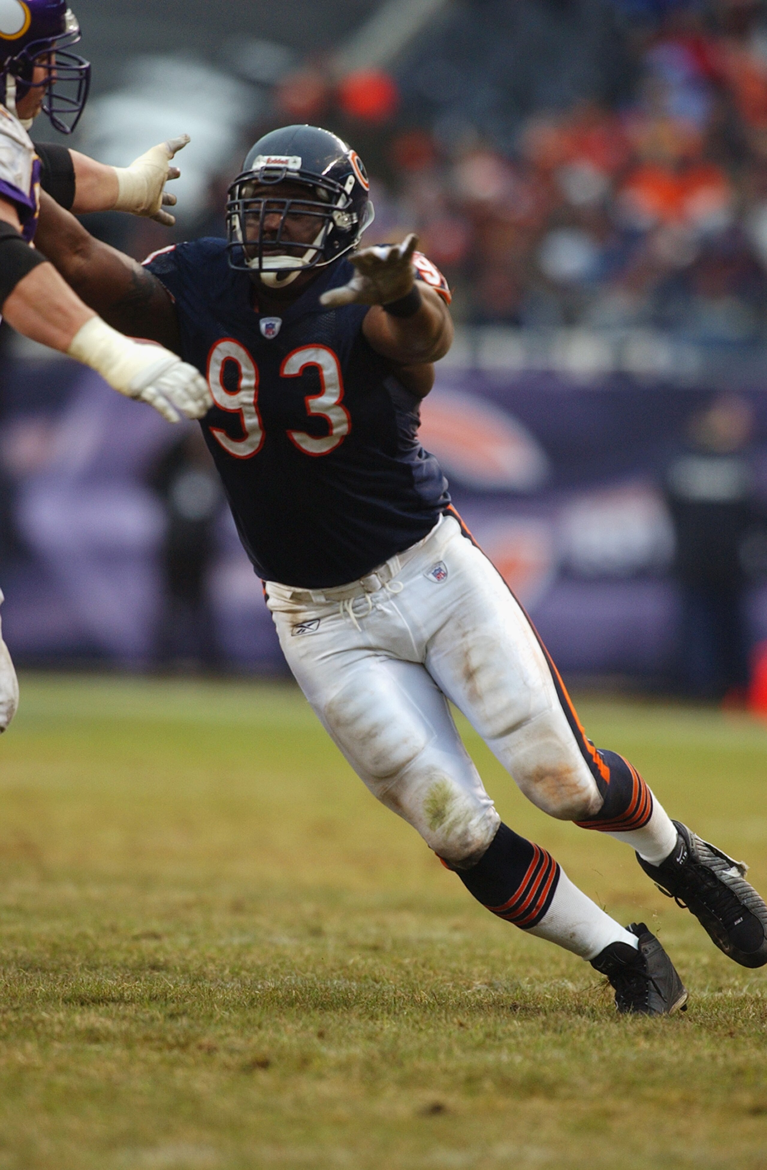 CHICAGO - DECEMBER 14:  Defensive end Phillip Daniels #93 of the Chicago Bears looks to make a play during the game against the Minnesota Vikings on December 14, 2003 at Soldier Field in Chicago, Illinois. The Bears defeated the Vikings 13-10. (Photo by J