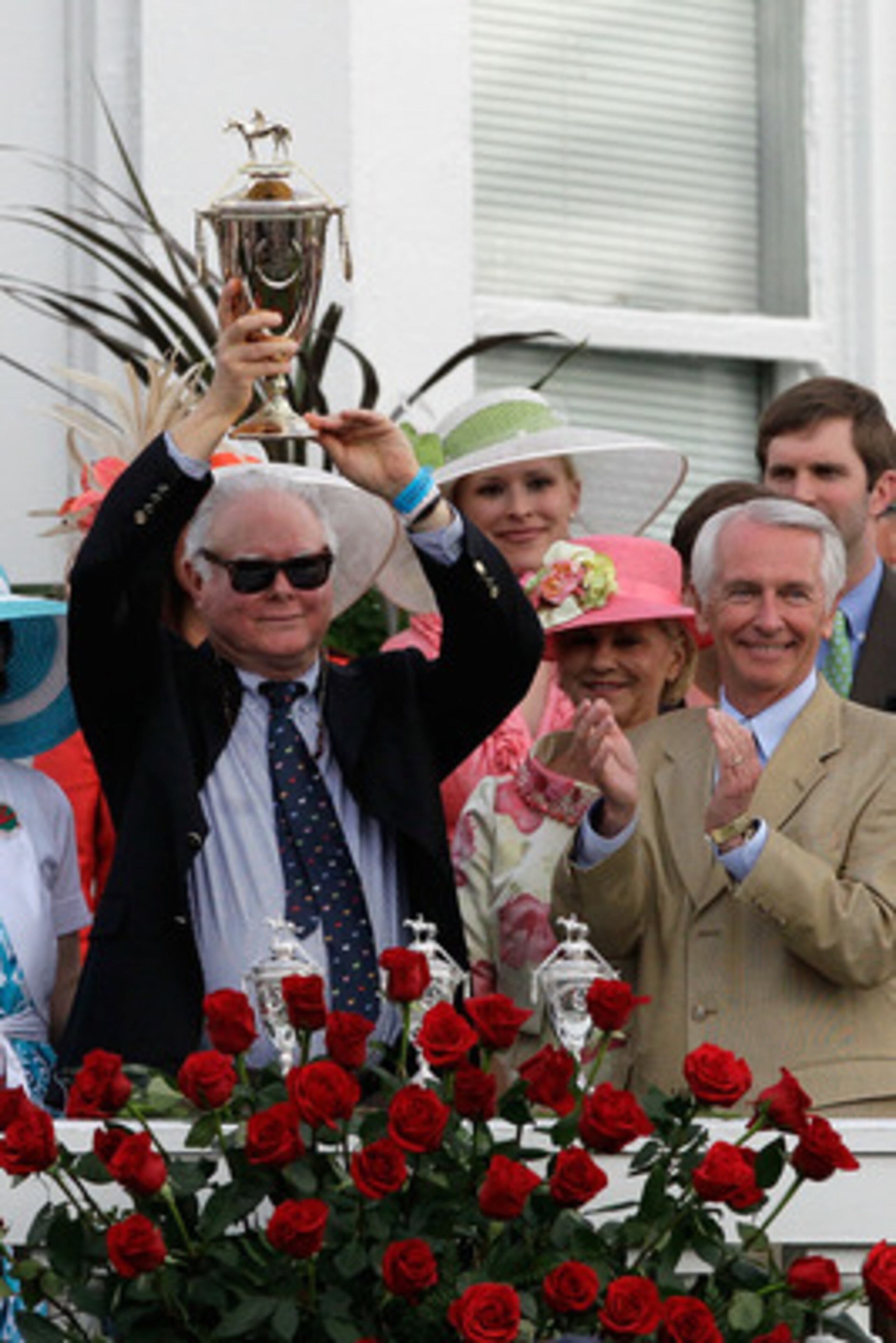 LOUISVILLE, KY - MAY 07:  Barry Irwin, owner of Animal Kingdom riden by John Velazquez, celebrates with the trophy in the winner's circle after they won the 137th Kentucky Derby at Churchill Downs on May 7, 2011 in Louisville, Kentucky.  (Photo by Rob Car