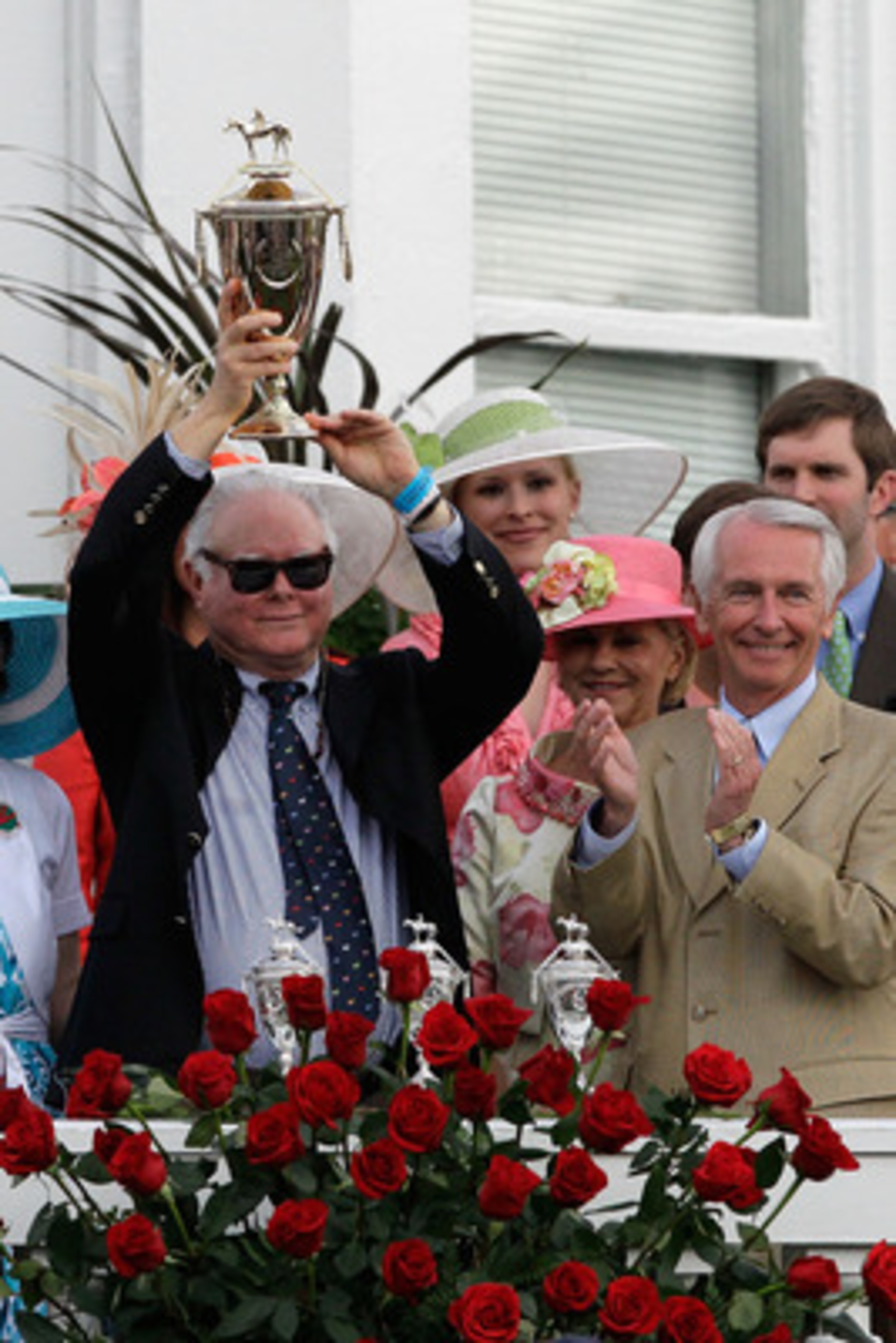 LOUISVILLE, KY - MAY 07:  Barry Irwin, owner of Animal Kingdom riden by John Velazquez, celebrates with the trophy in the winner's circle after they won the 137th Kentucky Derby at Churchill Downs on May 7, 2011 in Louisville, Kentucky.  (Photo by Rob Car