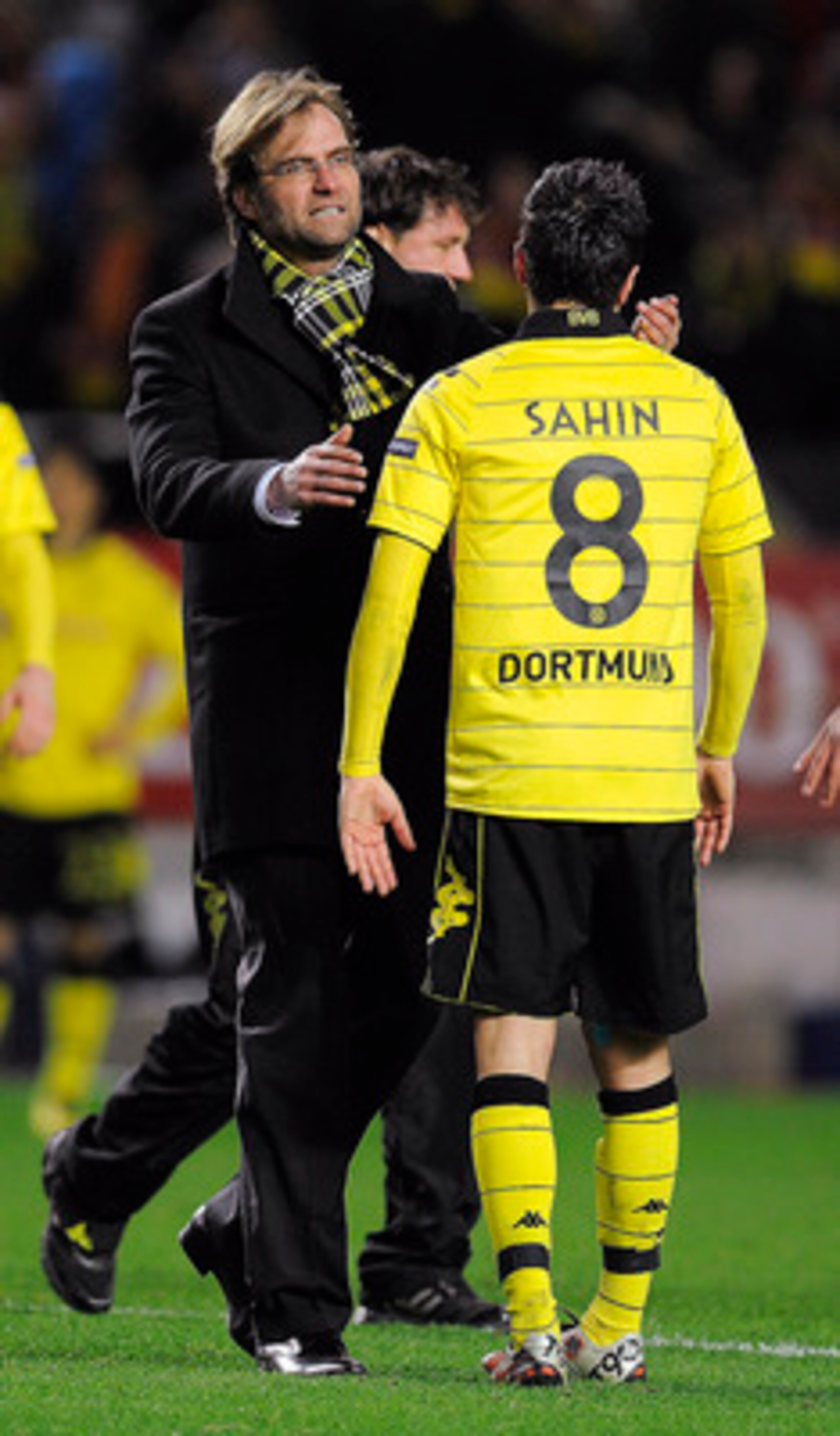 SEVILLE, SPAIN - DECEMBER 15:  Head coach Jurgen Klopp of Borussia Dortmund (L) conforts to Nuri Sahin at the end of the UEFA Europa League group J match between Sevilla and Borussia Dortmund at Estadio Ramon Sanchez Pizjuan on December 15, 2010 in Sevill