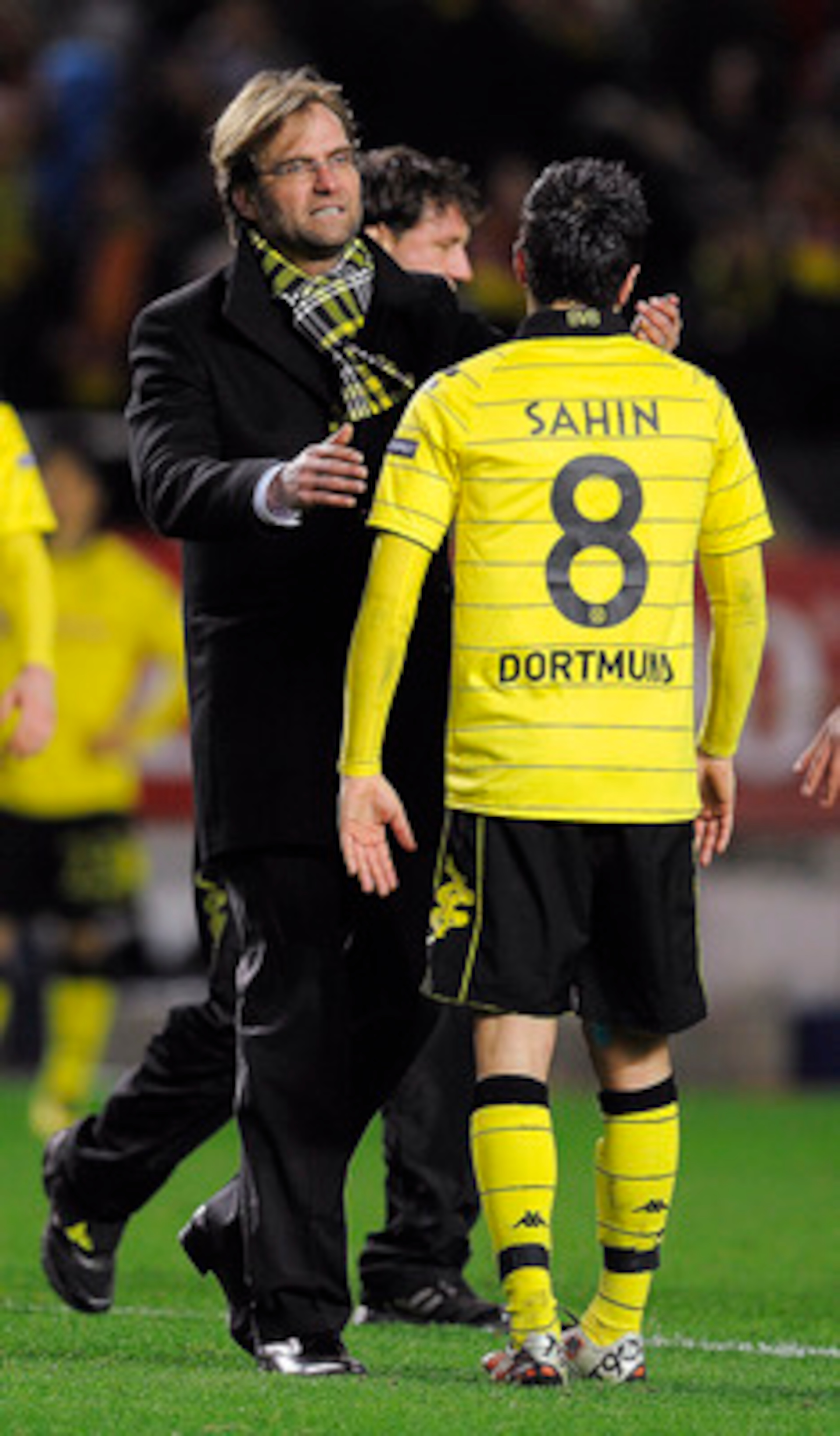 SEVILLE, SPAIN - DECEMBER 15:  Head coach Jurgen Klopp of Borussia Dortmund (L) conforts to Nuri Sahin at the end of the UEFA Europa League group J match between Sevilla and Borussia Dortmund at Estadio Ramon Sanchez Pizjuan on December 15, 2010 in Sevill