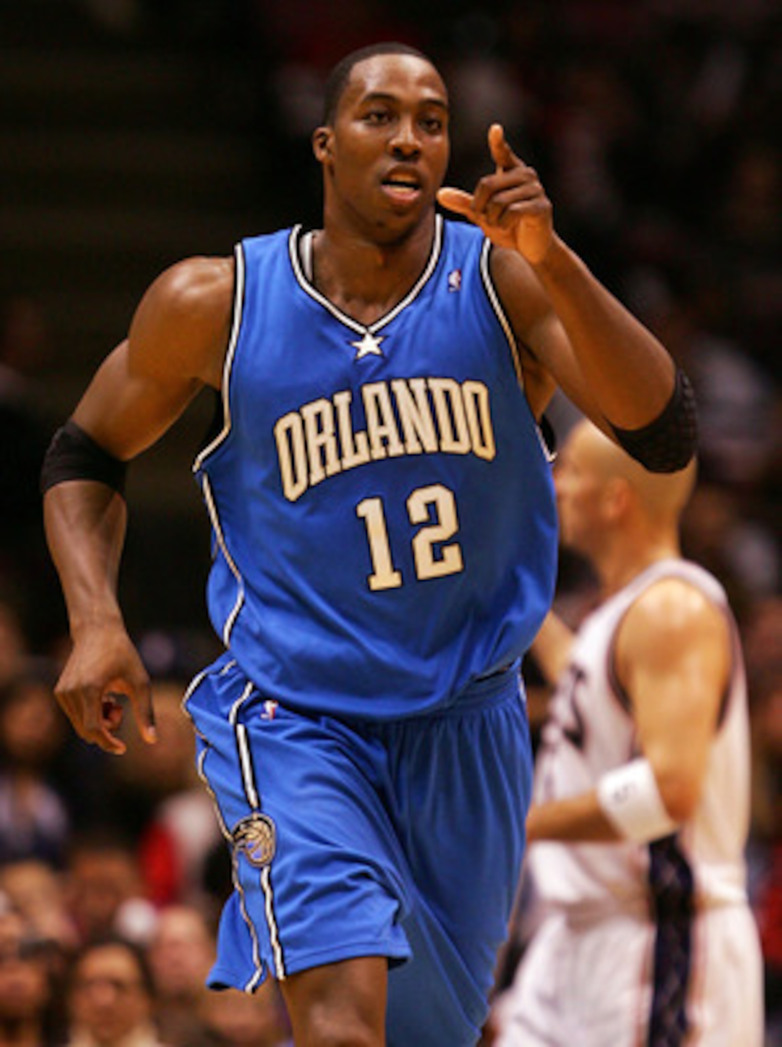 EAST RUTHERFORD, NJ - NOVEMBER 16:  Dwight Howard #12 of the Orlando Magic celebrates a basket against the New Jersey Nets during their game at the Izod Center on November 16, 2007 in East Rutherford, New Jersey.The Magic defeated the Nets 95-70. NOTE TO 