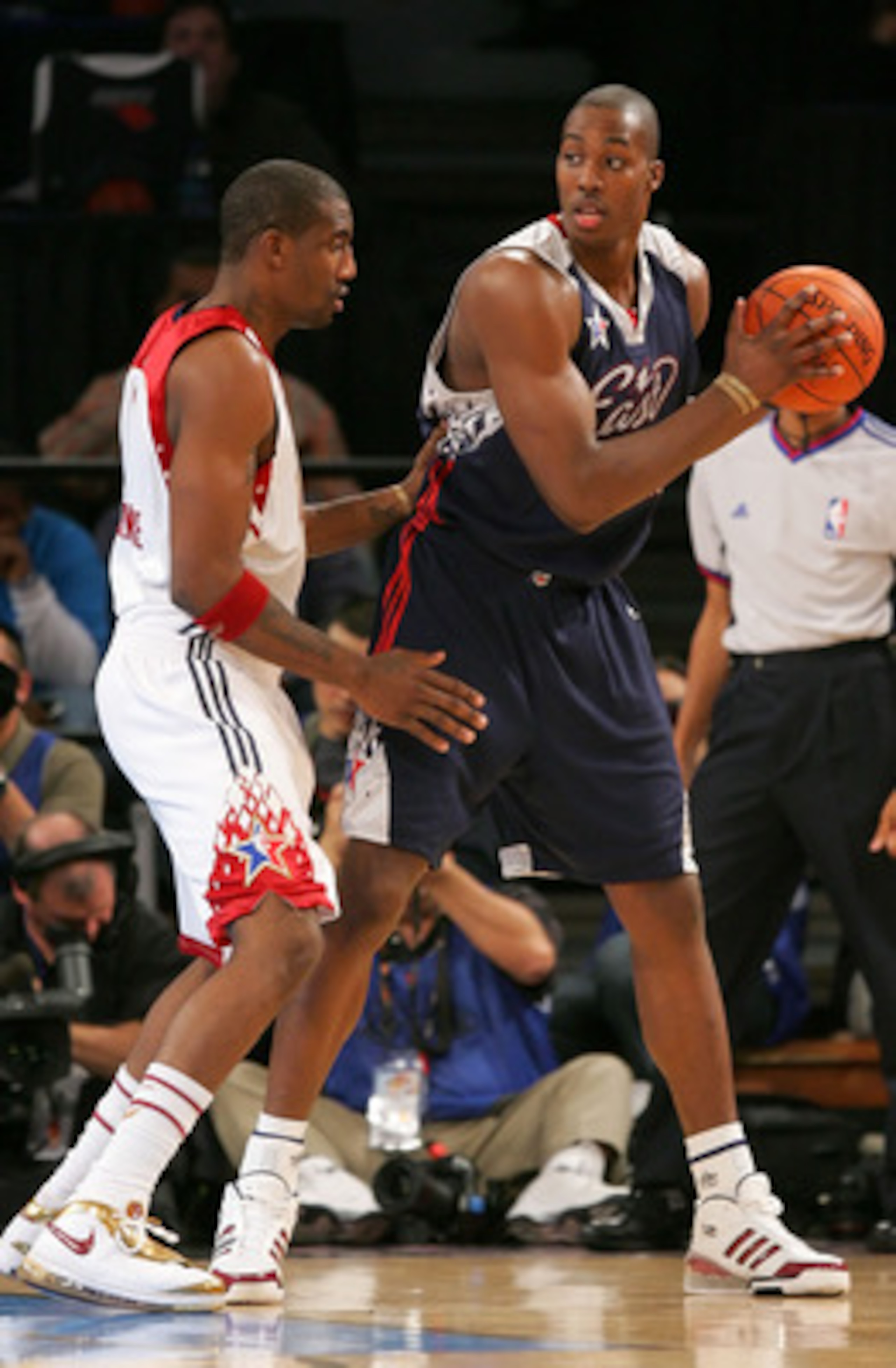 LAS VEGAS - FEBRUARY 18:  Dwight Howard #12 of the Eastern Conference looks for an open pass over  Amare Stoudemire #1 of the Western Conference during the 2007 NBA All-Star Game on February 18, 2007 at Thomas & Mack Center in Las Vegas, Nevada.  NOTE TO 