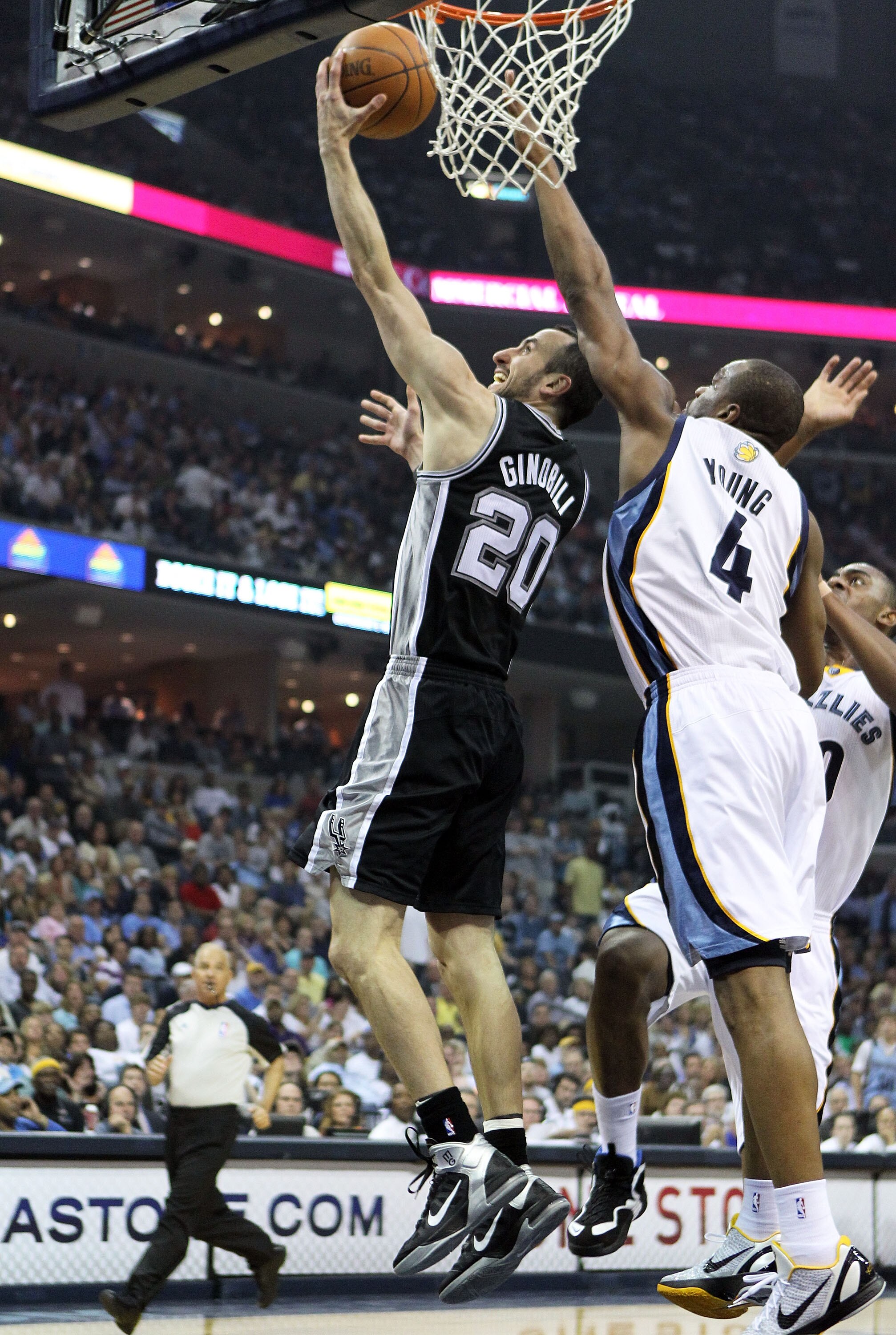 MEMPHIS, TN - APRIL 29: Manu Ginobili #20 of the San Antonio Spurs shoots the ball while defended by Sam Young #4 of the Memphis Grizzlies in Game Six of the Western Conference Quarterfinals in the 2011 NBA Playoffs at FedExForum on April 29, 2011 in Mem MEMPHIS, TN - APRIL 29: Manu Ginobili #20 of the San Antonio Spurs shoots the ball while defended by Sam Young #4 of the Memphis Grizzlies in Game Six of the Western Conference Quarterfinals in the 2011 NBA Playoffs at FedExForum on April 29, 2011 in Mem