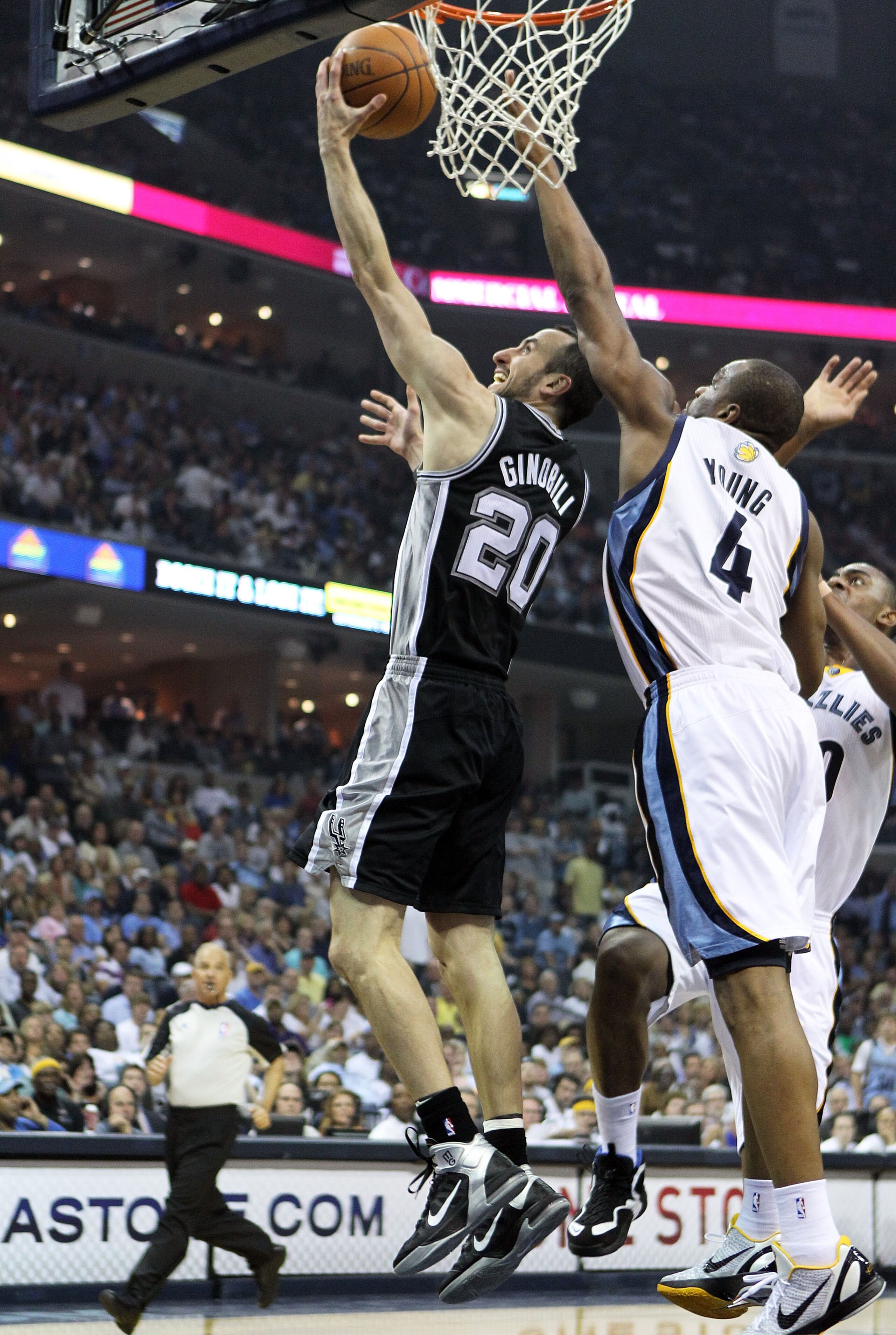 MEMPHIS, TN - APRIL 29:  Manu Ginobili #20 of the San Antonio Spurs shoots the ball while defended by Sam Young #4 of the Memphis Grizzlies in Game Six of the Western Conference Quarterfinals in the 2011 NBA Playoffs at FedExForum on April 29, 2011 in Mem