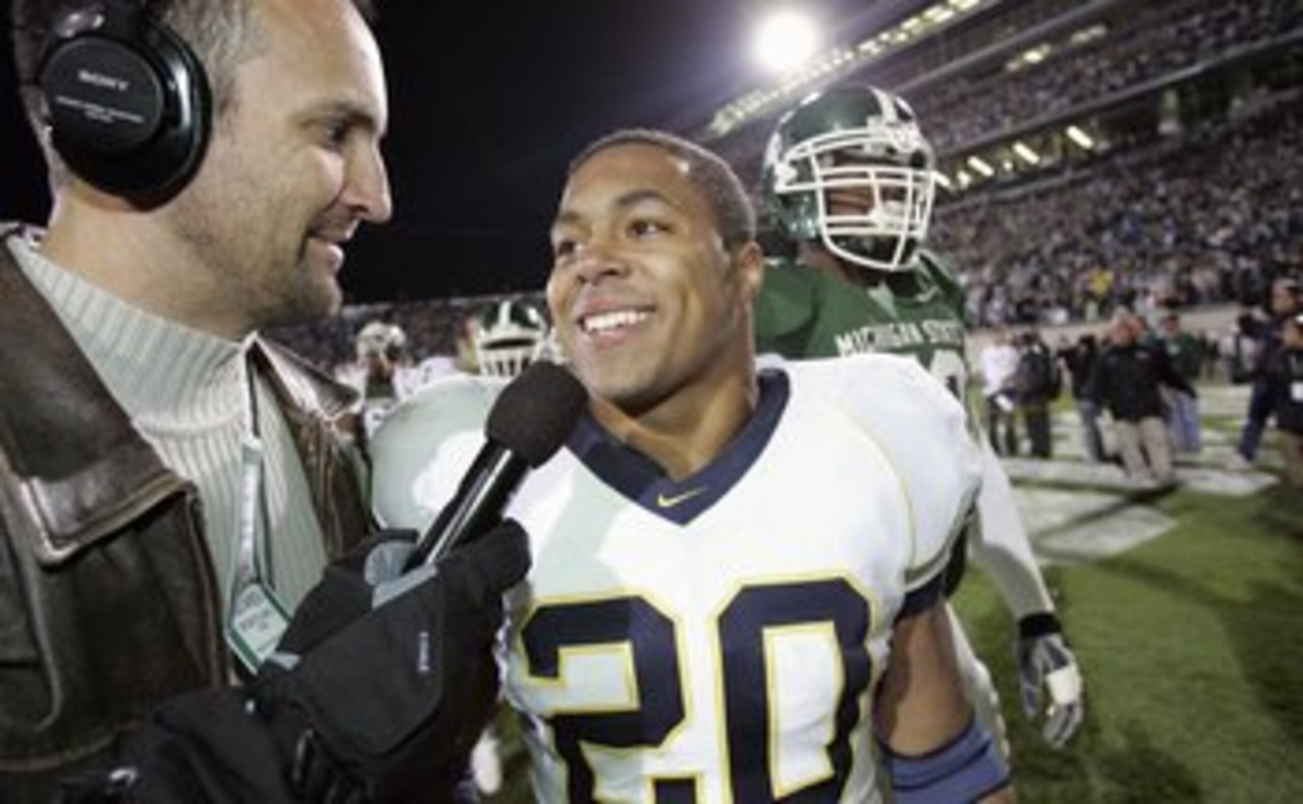 EAST LANSING, MI - NOVEMBER 3:  Mike Hart #20 of the Michigan Wolverines talks with a reporter after the win against the Michigan State Spartans at Spartan Stadium November 3, 2007 in East Lansing, Michigan.  Michigan defeated Michigan State 28-24. (Photo