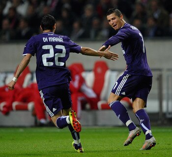AMSTERDAM, NETHERLANDS - NOVEMBER 23:  Cristiano Ronaldo of Real Madrid celebrates the third goal with Angel Di Maria during the UEFA Champions League Group G match between AFC Ajax and Real Madrid at the Ajax Arena on November 23, 2010 in Amsterdam, Neth