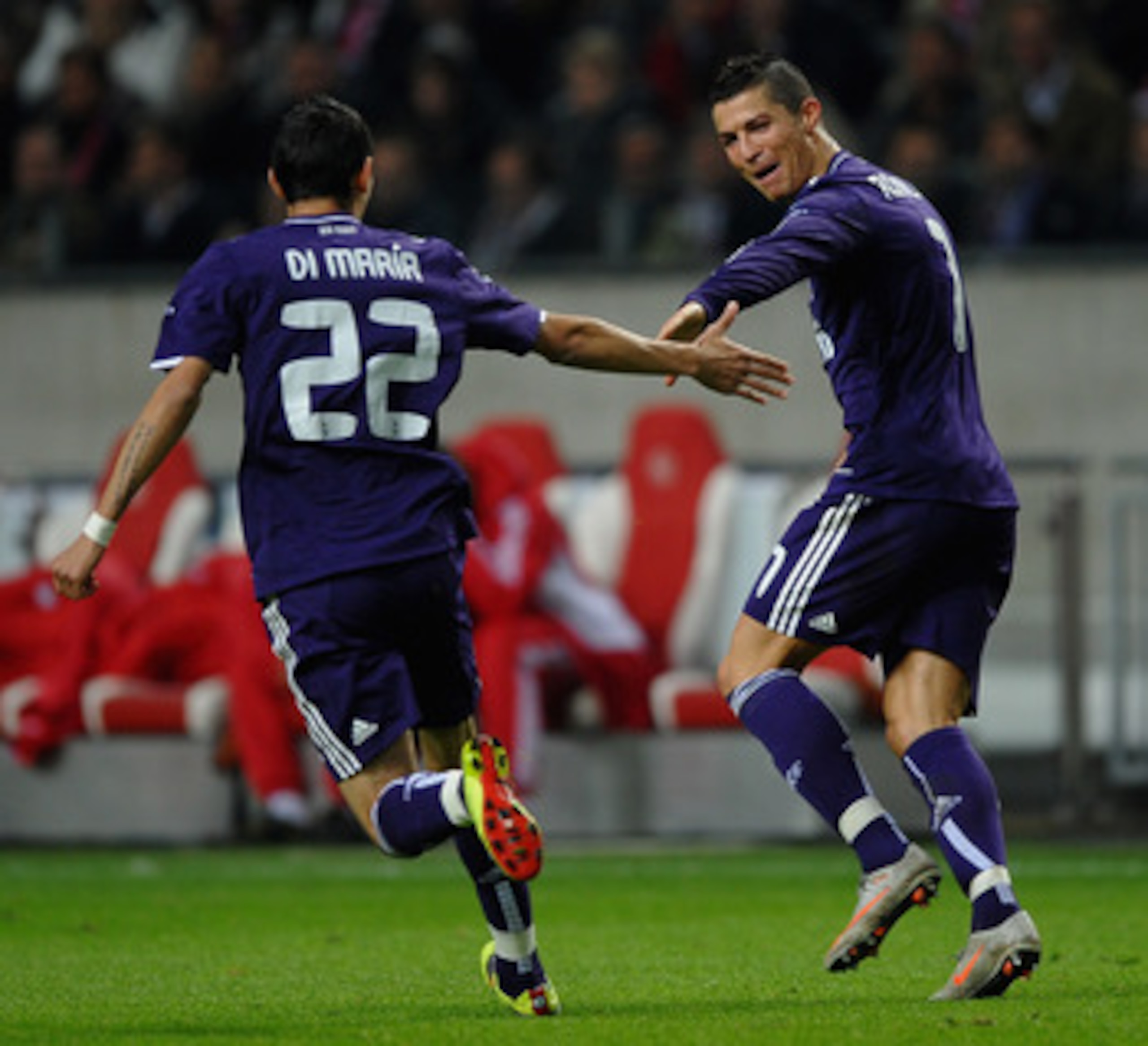 AMSTERDAM, NETHERLANDS - NOVEMBER 23:  Cristiano Ronaldo of Real Madrid celebrates the third goal with Angel Di Maria during the UEFA Champions League Group G match between AFC Ajax and Real Madrid at the Ajax Arena on November 23, 2010 in Amsterdam, Neth