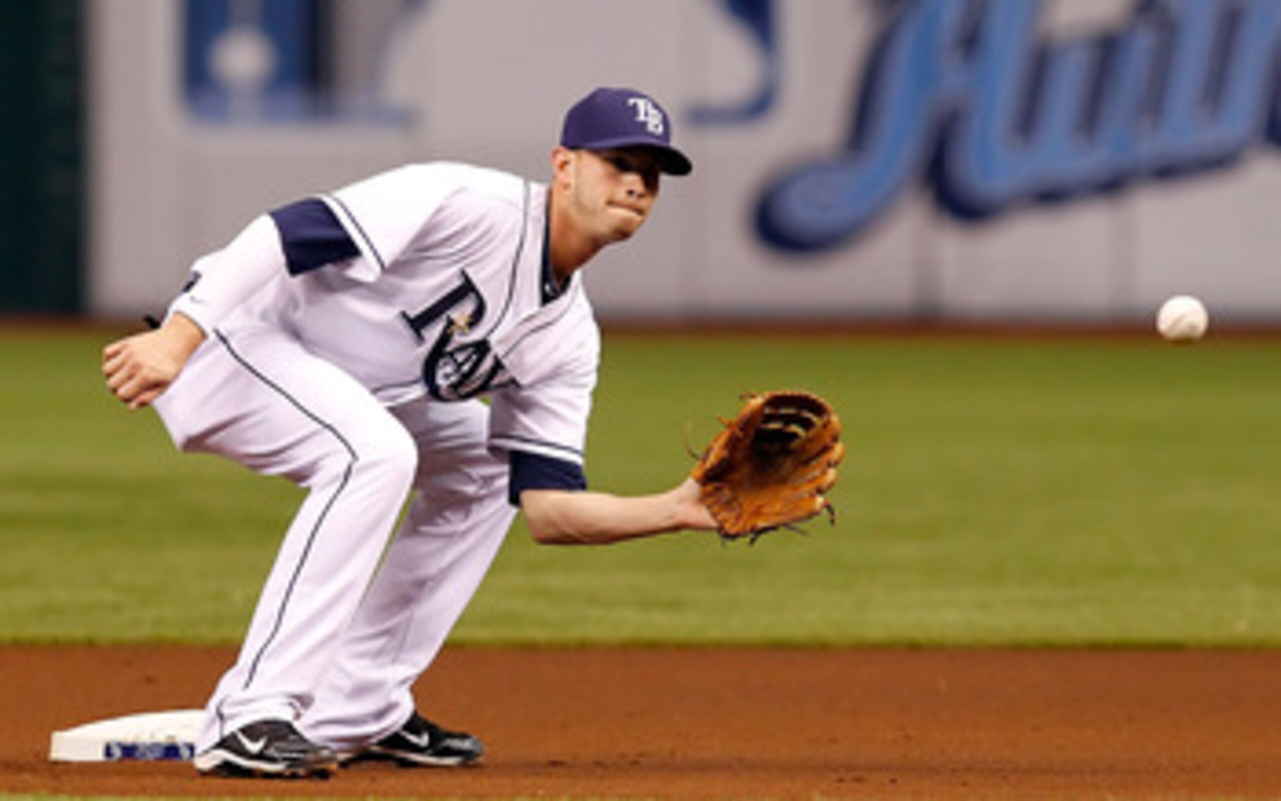 ST. PETERSBURG, FL - APRIL 21:  Shortstop Reid Brignac #15 of the Tampa Bay Rays takes the throw at second against the Chicago White Sox during the game at Tropicana Field on April 21, 2011 in St. Petersburg, Florida.  (Photo by J. Meric/Getty Images)