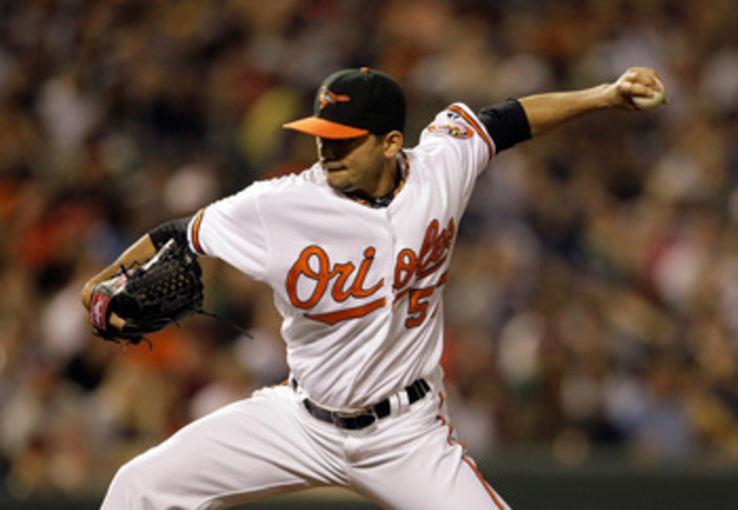 BALTIMORE, MD - APRIL 23:  Pitcher Clay Rapada #57 of the Baltimore Orioles delivers to a New York Yankees batter at Oriole Park at Camden Yards on April 23, 2011 in Baltimore, Maryland.  (Photo by Rob Carr/Getty Images)