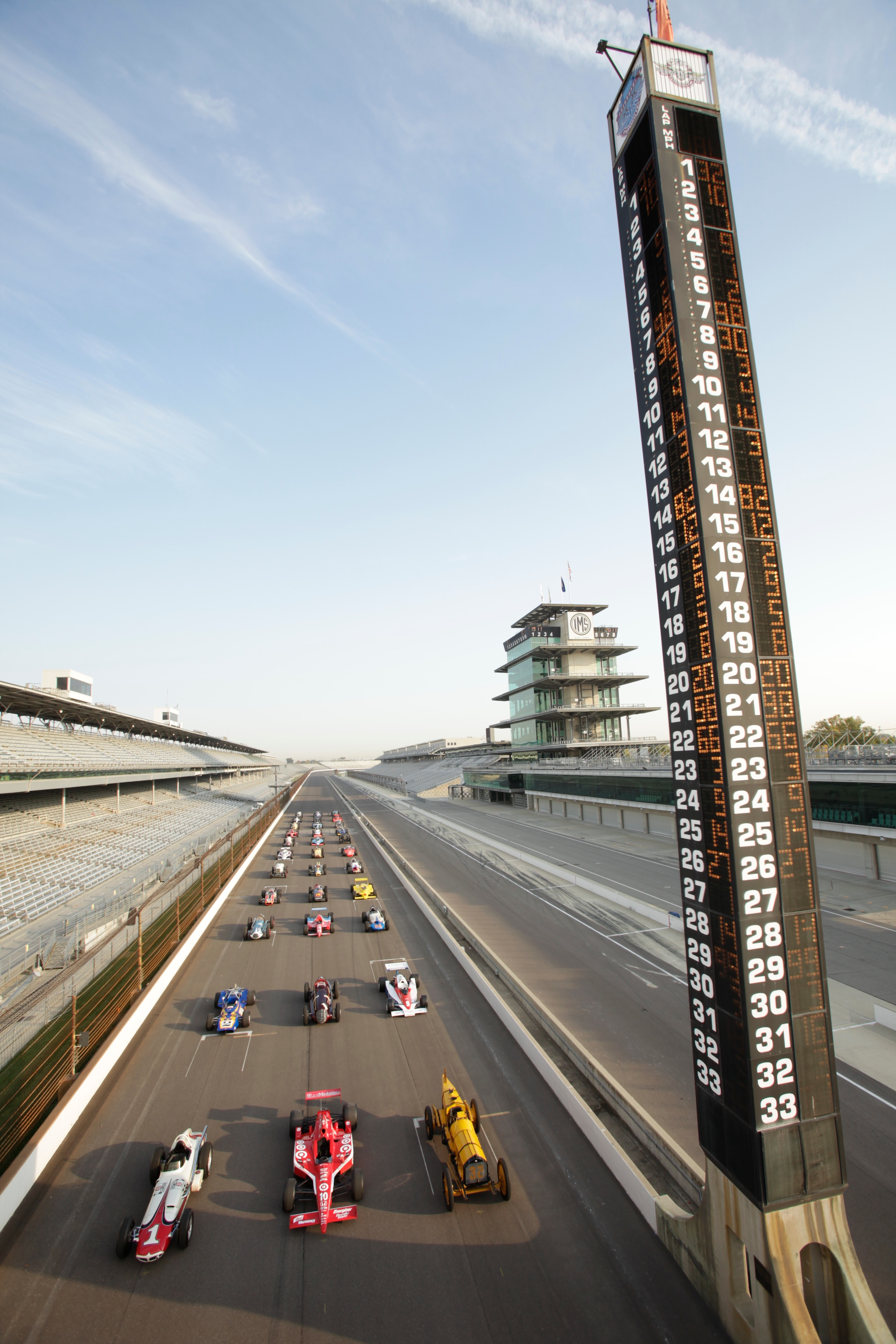 INDIANAPOLIS - OCTOBER 12: 33 of the greatest race cars that won the Indianapolis 500 lineup during a photo shoot at the Indianapolis Motor Speedway on October 12, 2010 in Indianapolis, Indiana. Amongst the display are, Ray Harroun (Front Row-R) driving INDIANAPOLIS - OCTOBER 12: 33 of the greatest race cars that won the Indianapolis 500 lineup during a photo shoot at the Indianapolis Motor Speedway on October 12, 2010 in Indianapolis, Indiana. Amongst the display are, Ray Harroun (Front Row-R) driving