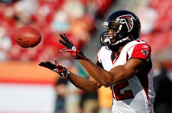 TAMPA, FL - DECEMBER 05:  Receiver Michael Jenkins #12 of the Atlanta Falcons catches a pass during warmups against the Tampa Bay Buccaneers at Raymond James Stadium on December 5, 2010 in Tampa, Florida.  (Photo by J. Meric/Getty Images)