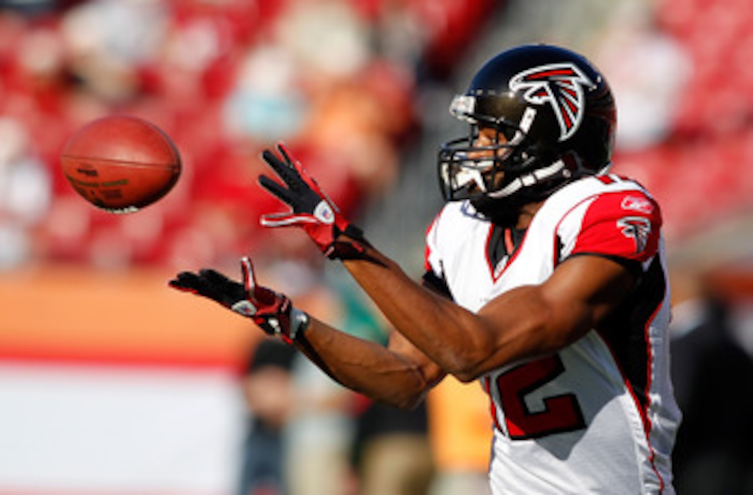 TAMPA, FL - DECEMBER 05:  Receiver Michael Jenkins #12 of the Atlanta Falcons catches a pass during warmups against the Tampa Bay Buccaneers at Raymond James Stadium on December 5, 2010 in Tampa, Florida.  (Photo by J. Meric/Getty Images)
