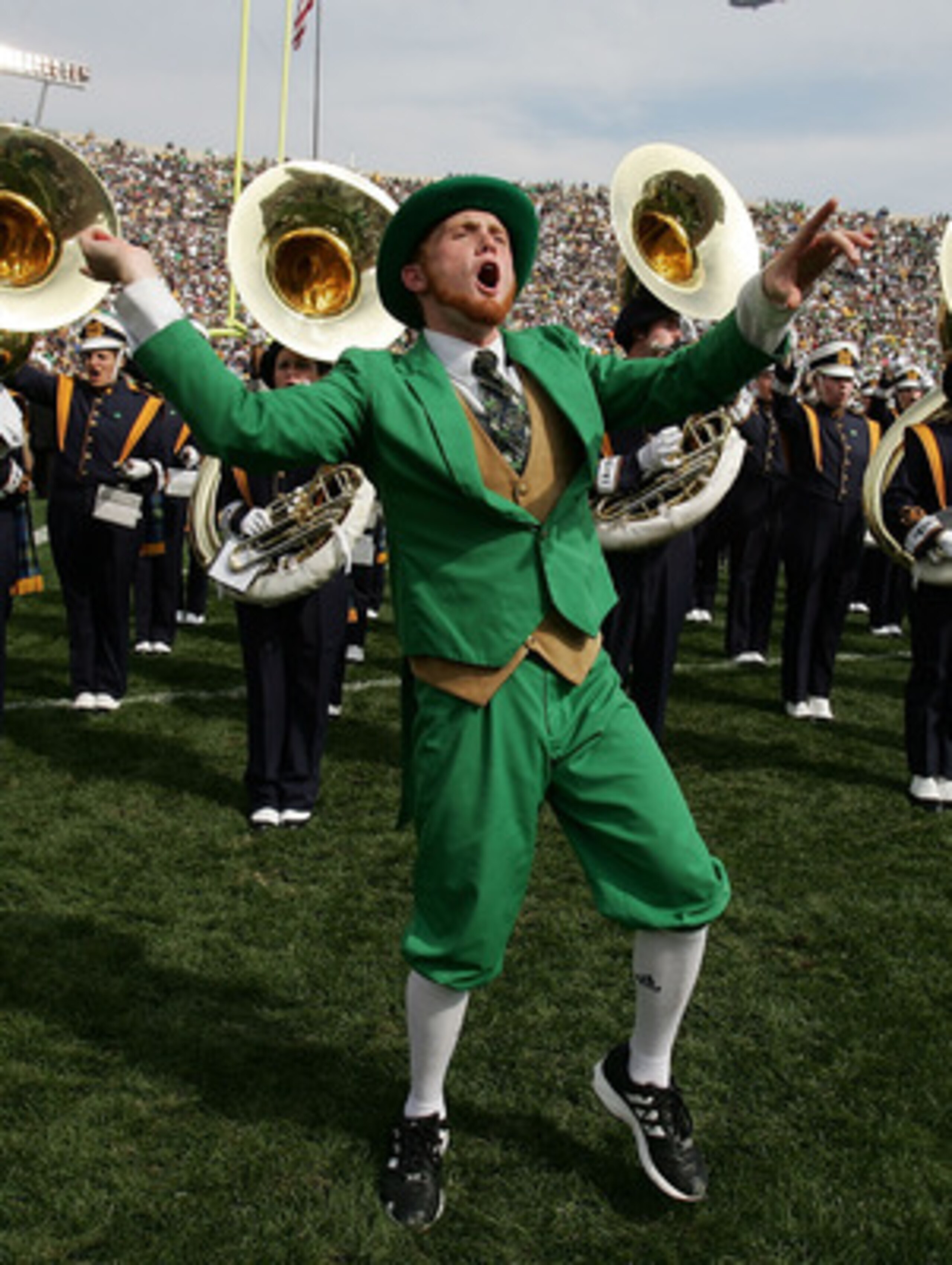 SOUTH BEND, IN - SEPTEMBER 16:  The Leprechaun from the Notre Dame Fighting Irish excites the crowd in front of the Notre Dame Marching band against of the Michigan Wolverines September 16, 2006 at Notre Dame Stadium in South Bend, Indiana. Michigan won 4