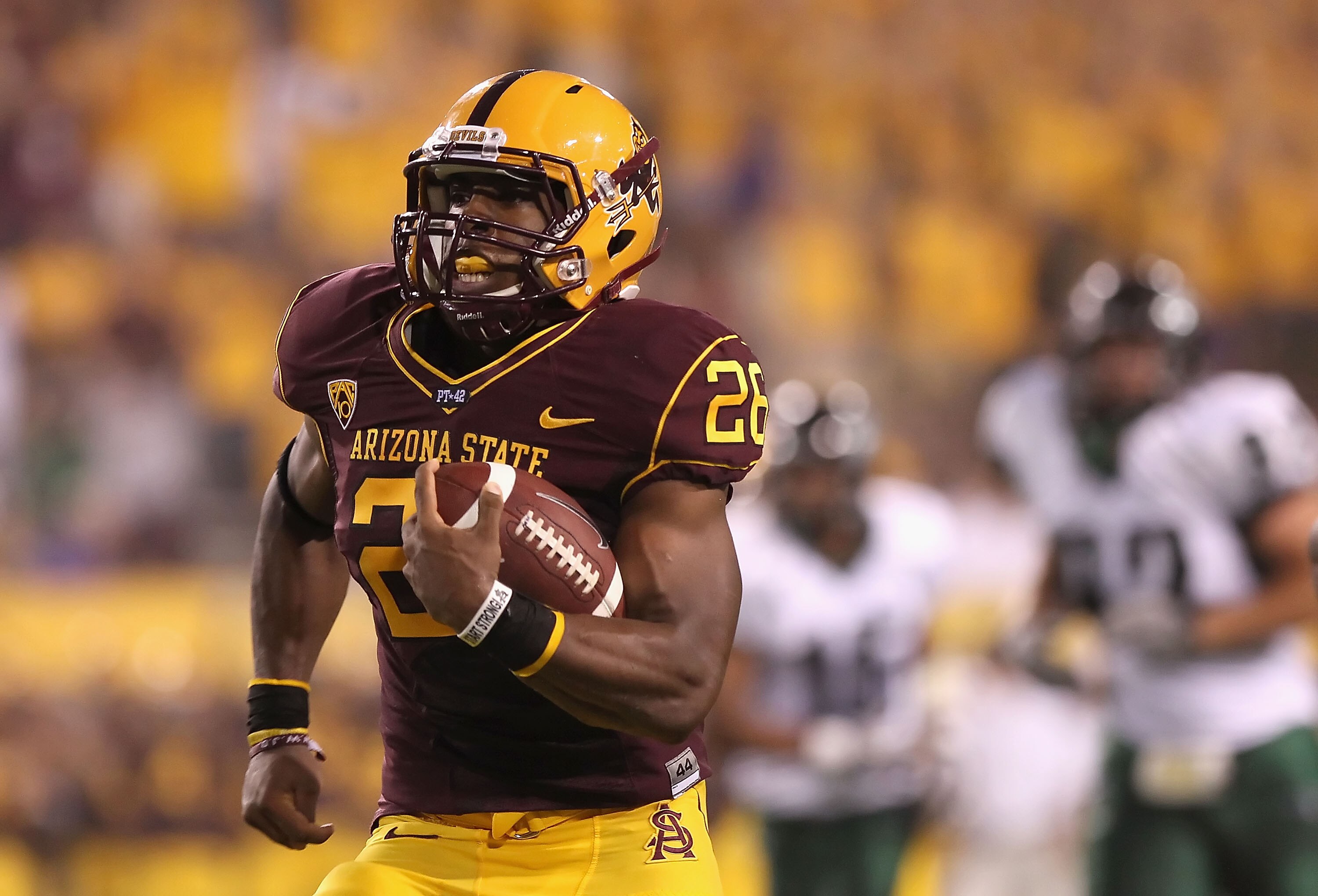 TEMPE, AZ - SEPTEMBER 04:  Runningback Cameron Marshall #26 of the Arizona State Sun Devils rushes the ball for a 38 yard touchdown against the Portland State Vikings during the first quarter of the college football game at Sun Devil Stadium on September