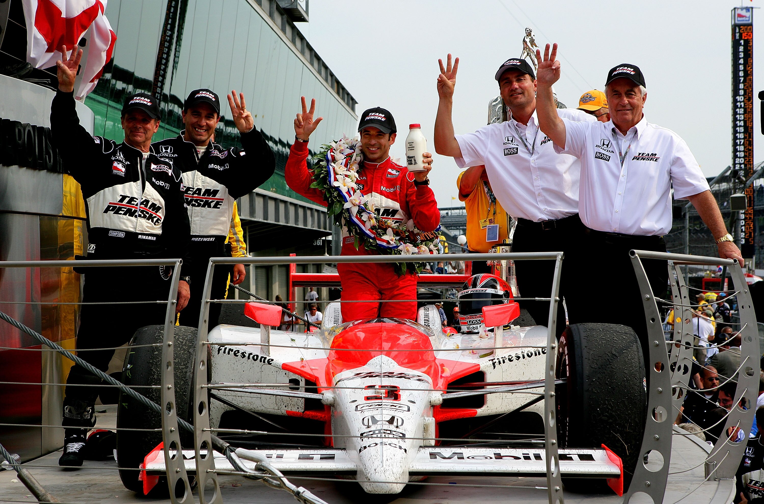 INDIANAPOLIS - MAY 24:  (R-L) Team owner Roger Penske, president of Penske Racing, Tim Cimdric, Helio Castroneves, driver of the #3 Team Penske Dallara Honda, engineer Ron Ruzewski, crew chief Rick Rinaman, celebrate in victory lane after winning the IRL