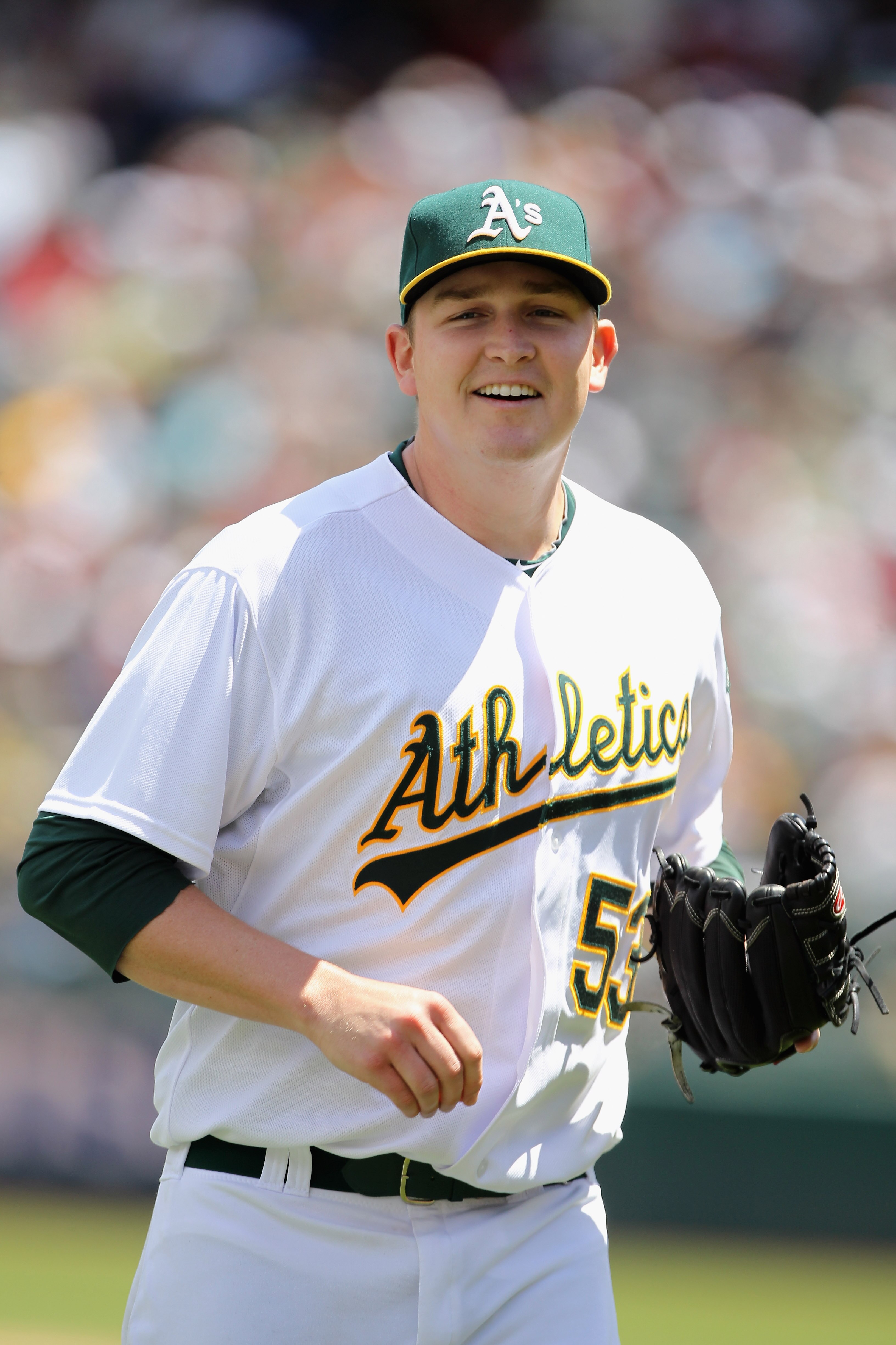 OAKLAND, CA - MAY 15:  Trevor Cahill #53 of the Oakland Athletics jogs off the field after a double play ended the third inning of their game against the Chicago White Sox at Oakland-Alameda County Coliseum on May 15, 2011 in Oakland, California.  (Photo