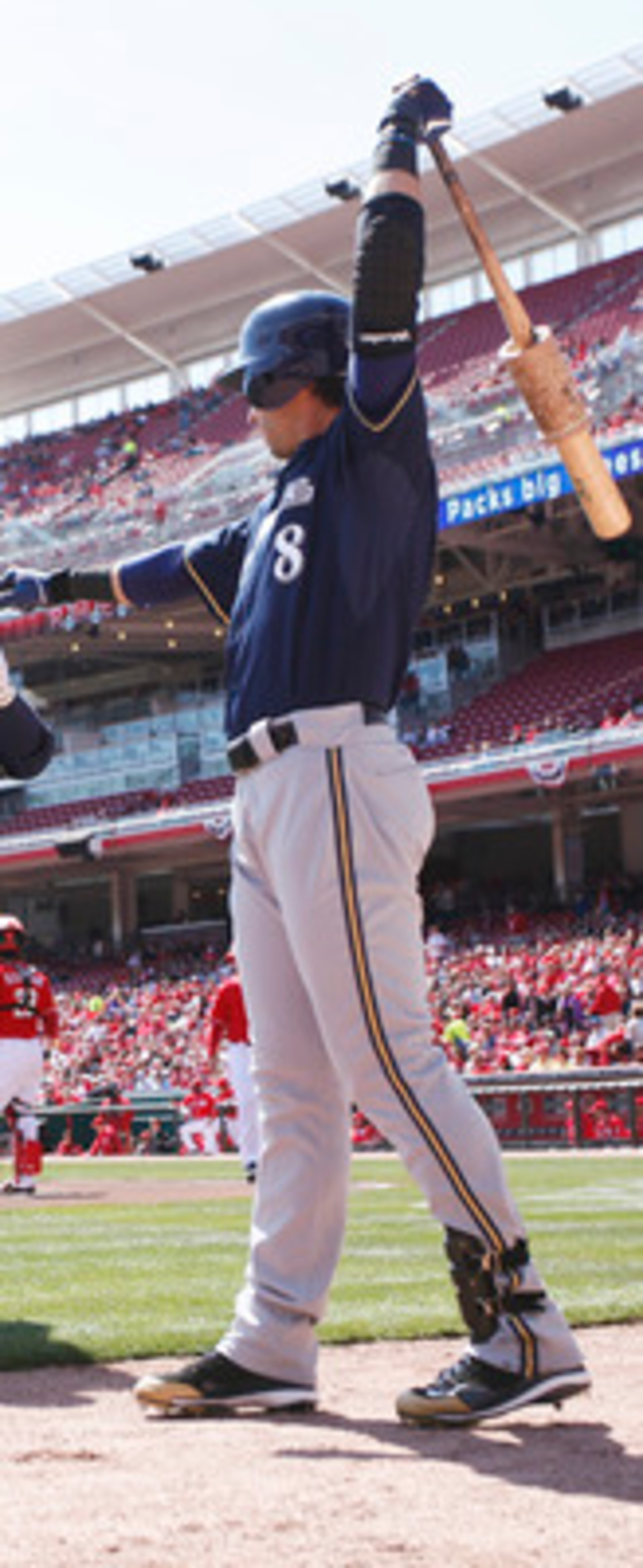 CINCINNATI, OH - APRIL 3: Rickie Weeks #23 of the Milwaukee Brewers celebrates with Ryan Braun #8 after hitting a home run to lead off the game against the Cincinnati Reds at Great American Ball Park on April 3, 2011 in Cincinnati, Ohio. The Reds won 12-3