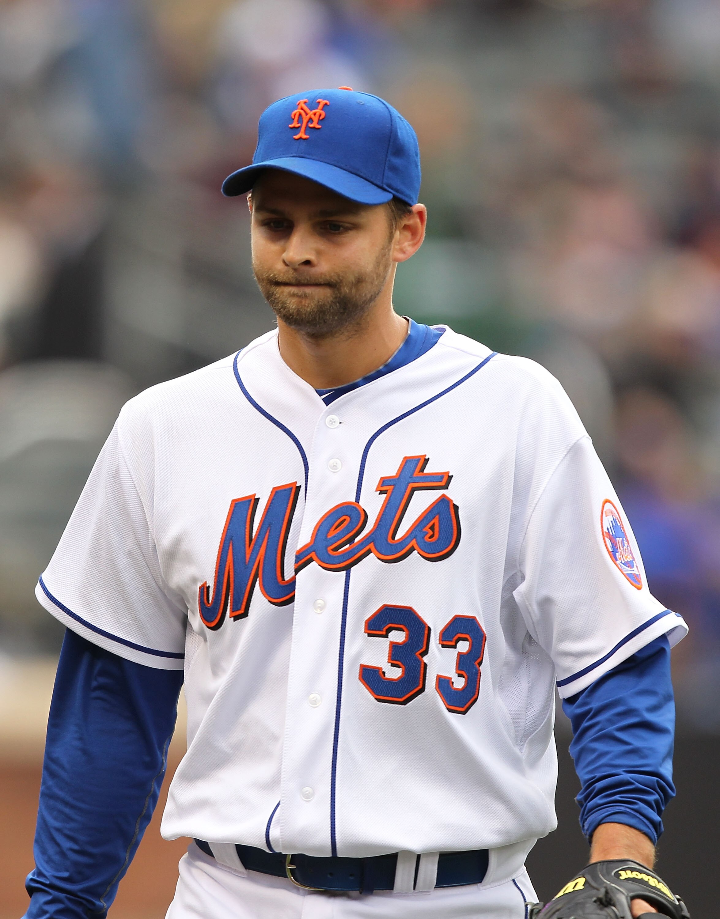 NEW YORK, NY - APRIL 10:  Taylor Buchholz #33 of the New York Mets reacts after retiring the side with bases loaded against the Washington Nationals during their game on April 10, 2011 at Citi Field in the Flushing neighborhood of the Queens borough of Ne