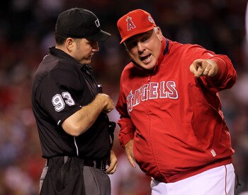 ANAHEIM, CA - MAY 11:  Manager Mike Scioscia of the Los Angeles Angels of Anaheim argues with home plate umpire Dan Bellino during the game with the Chicago White Sox on May 11, 2011 at Angel Stadium in Anaheim, California.  (Photo by Stephen Dunn/Getty I