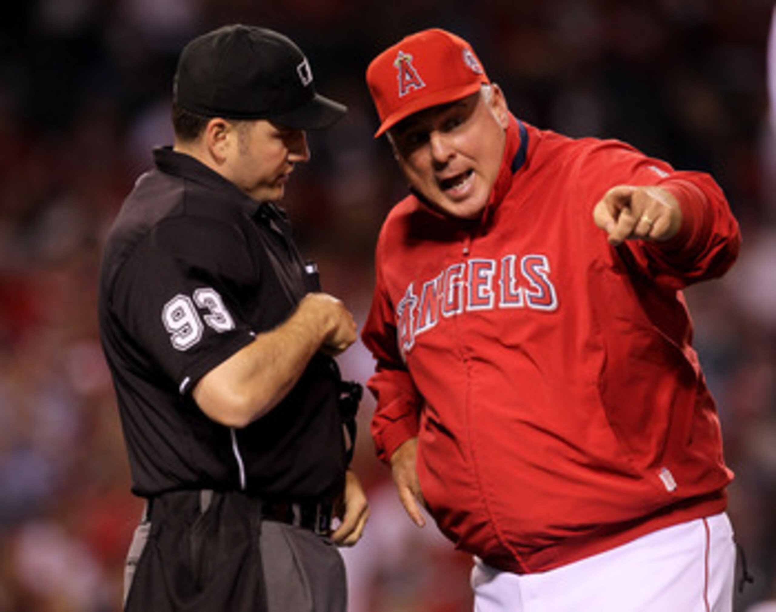 ANAHEIM, CA - MAY 11:  Manager Mike Scioscia of the Los Angeles Angels of Anaheim argues with home plate umpire Dan Bellino during the game with the Chicago White Sox on May 11, 2011 at Angel Stadium in Anaheim, California.  (Photo by Stephen Dunn/Getty I