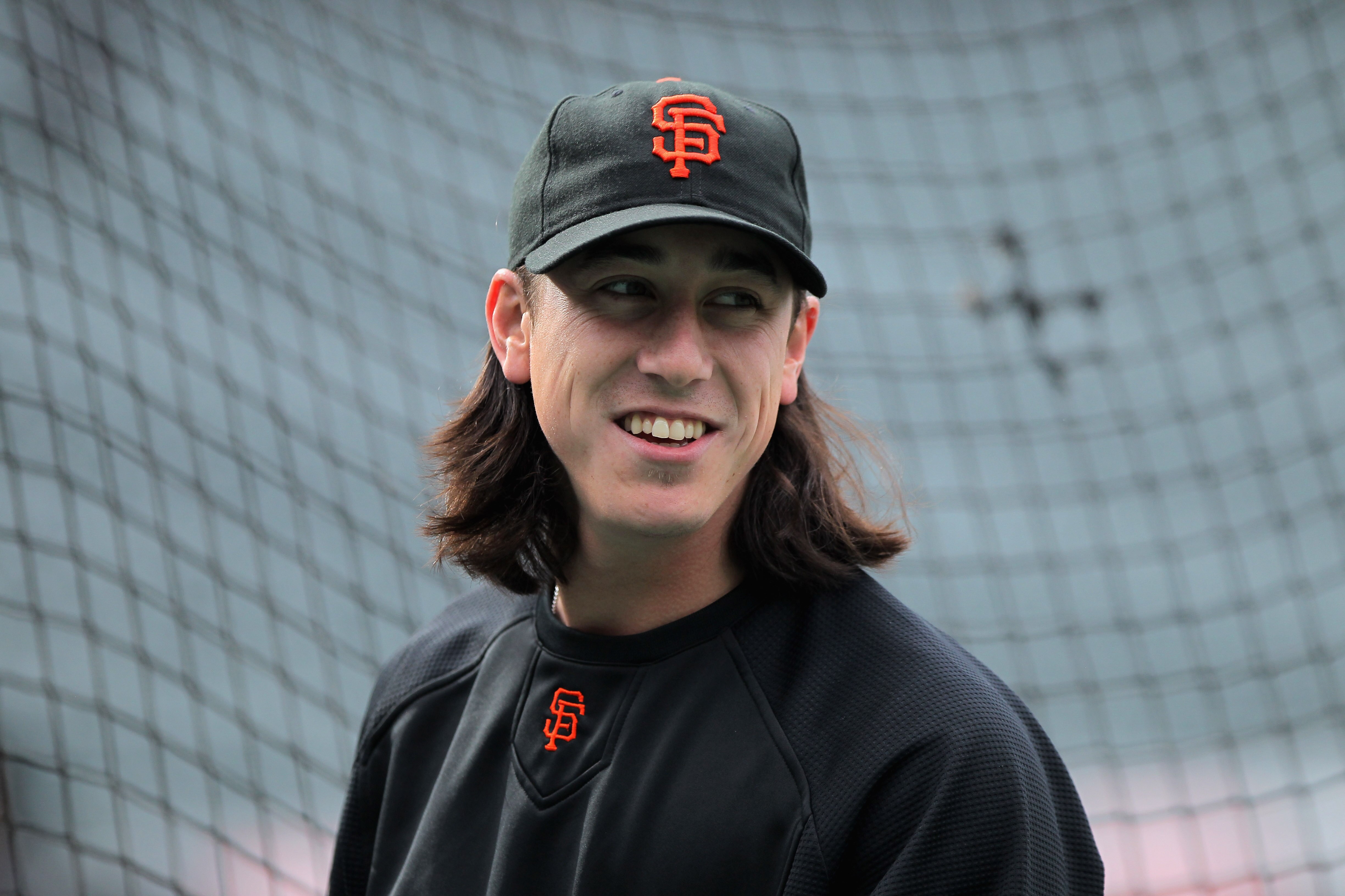DENVER, CO - APRIL 18:  Starting pitcher Tim Lincecum #55 of the San Francisco Giants looks on during batting practice prior to facing the Colorado Rockies at Coors Field on April 18, 2011 in Denver, Colorado. Lincecum recorded 10 strike outs as he earned