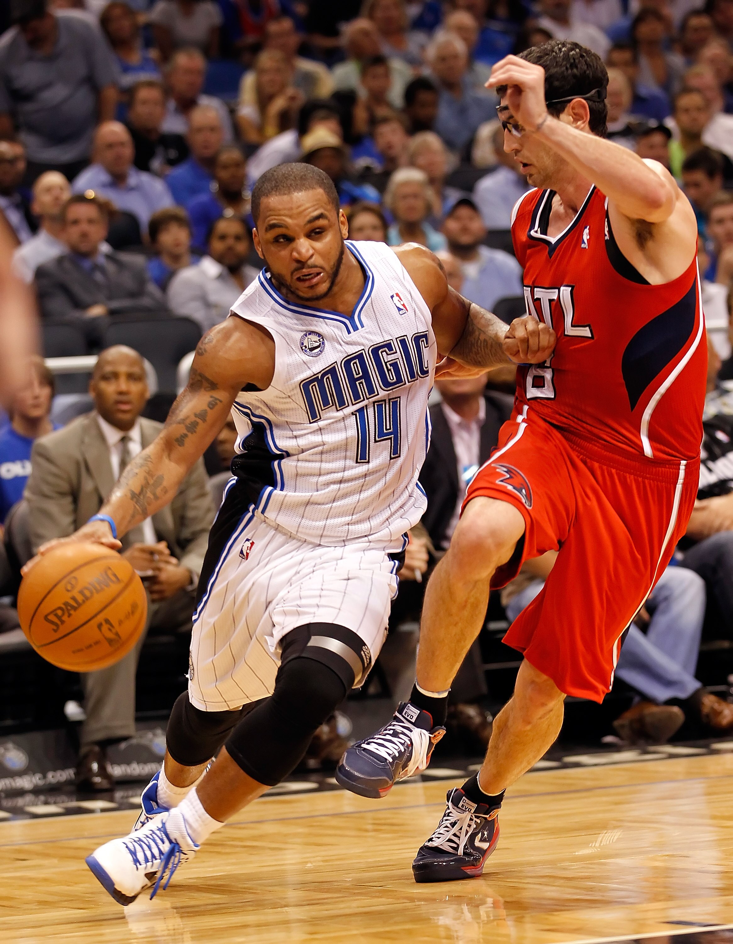 ORLANDO, FL - APRIL 19:  Jameer Nelson #14 of the Orlando Magic drives past Kirk Hinrich #6 of the Atlanta Hawks during Game Two of the Eastern Conference Quarterfinals of the 2011 NBA Playoffs on April 19, 2011 at the Amway Arena in Orlando, Florida.  NO