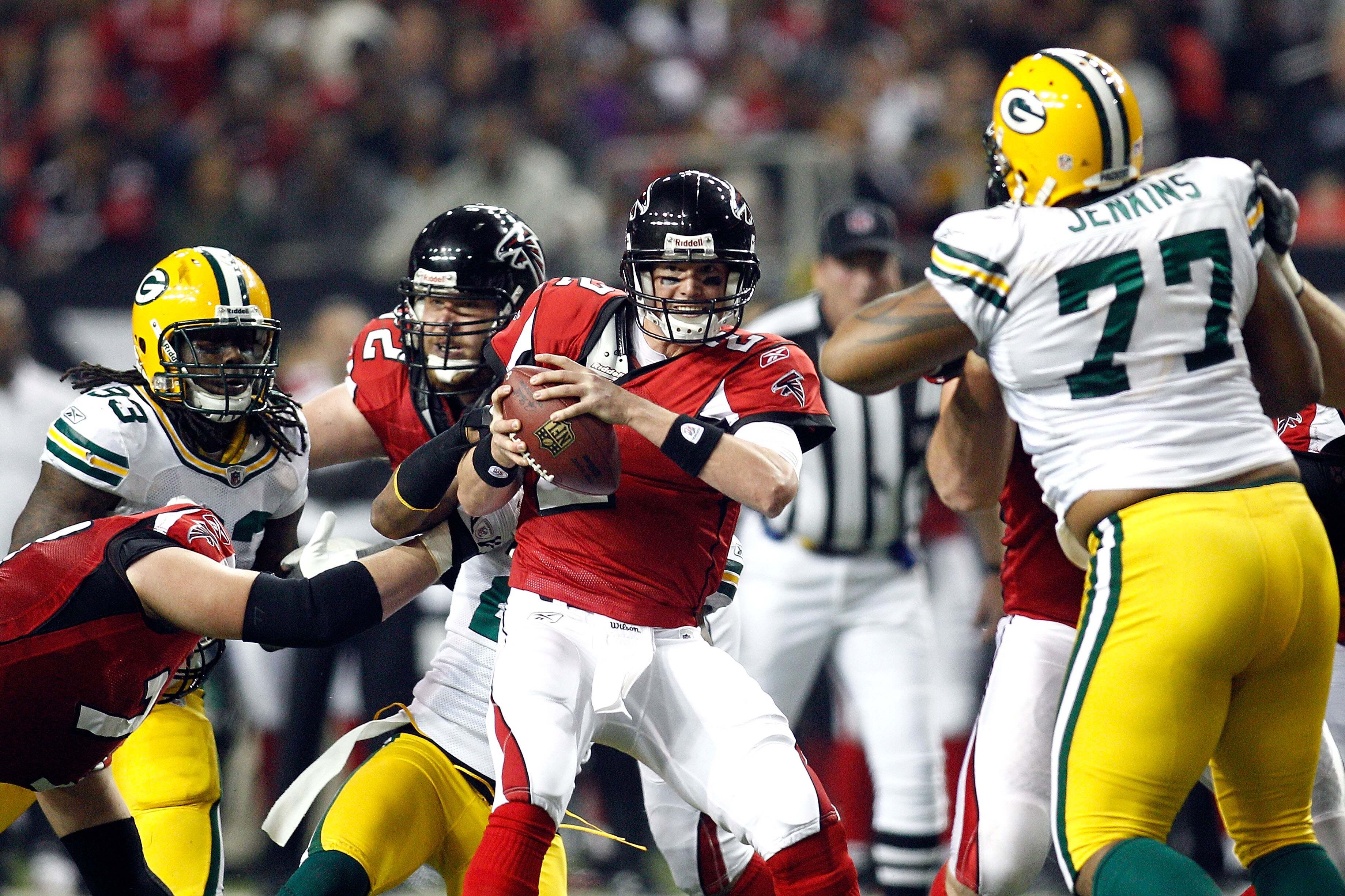 ATLANTA, GA - JANUARY 15:  Quarterback Matt Ryan #2 of the Atlanta Falcons attempts to avoid the pass rush by the Green Bay Packers during their 2011 NFC divisional playoff game at Georgia Dome on January 15, 2011 in Atlanta, Georgia. The Packers won 48-2