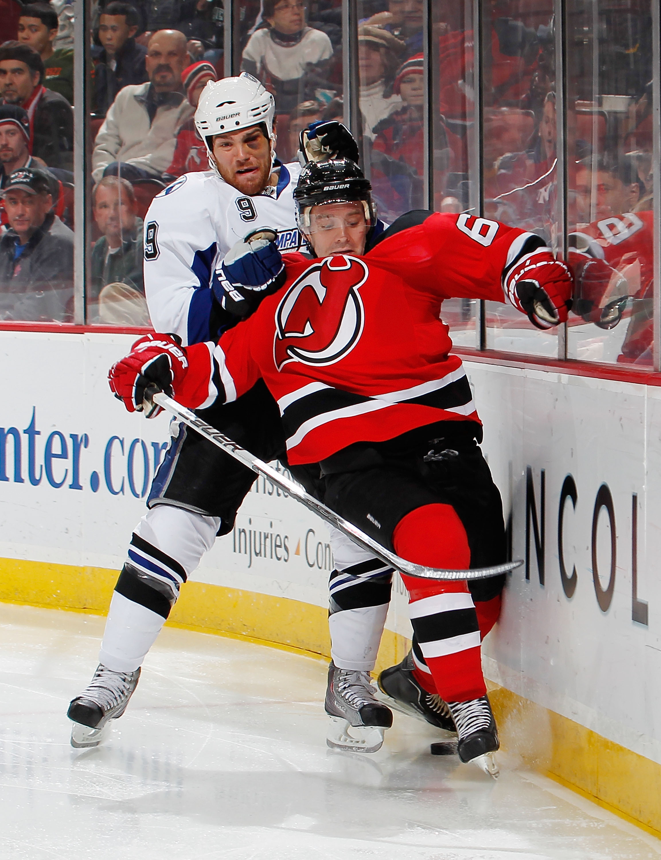 NEWARK, NJ - JANUARY 09: Steve Downie #9 of the Tampa Bay Lightning takes down Andy Greene #6 of the New Jersey Devils in the third period of an NHL hockey game at the Prudential Center on January 9, 2011 in Newark, New Jersey. (Photo by Paul Bereswill/Ge NEWARK, NJ - JANUARY 09: Steve Downie #9 of the Tampa Bay Lightning takes down Andy Greene #6 of the New Jersey Devils in the third period of an NHL hockey game at the Prudential Center on January 9, 2011 in Newark, New Jersey. (Photo by Paul Bereswill/Ge