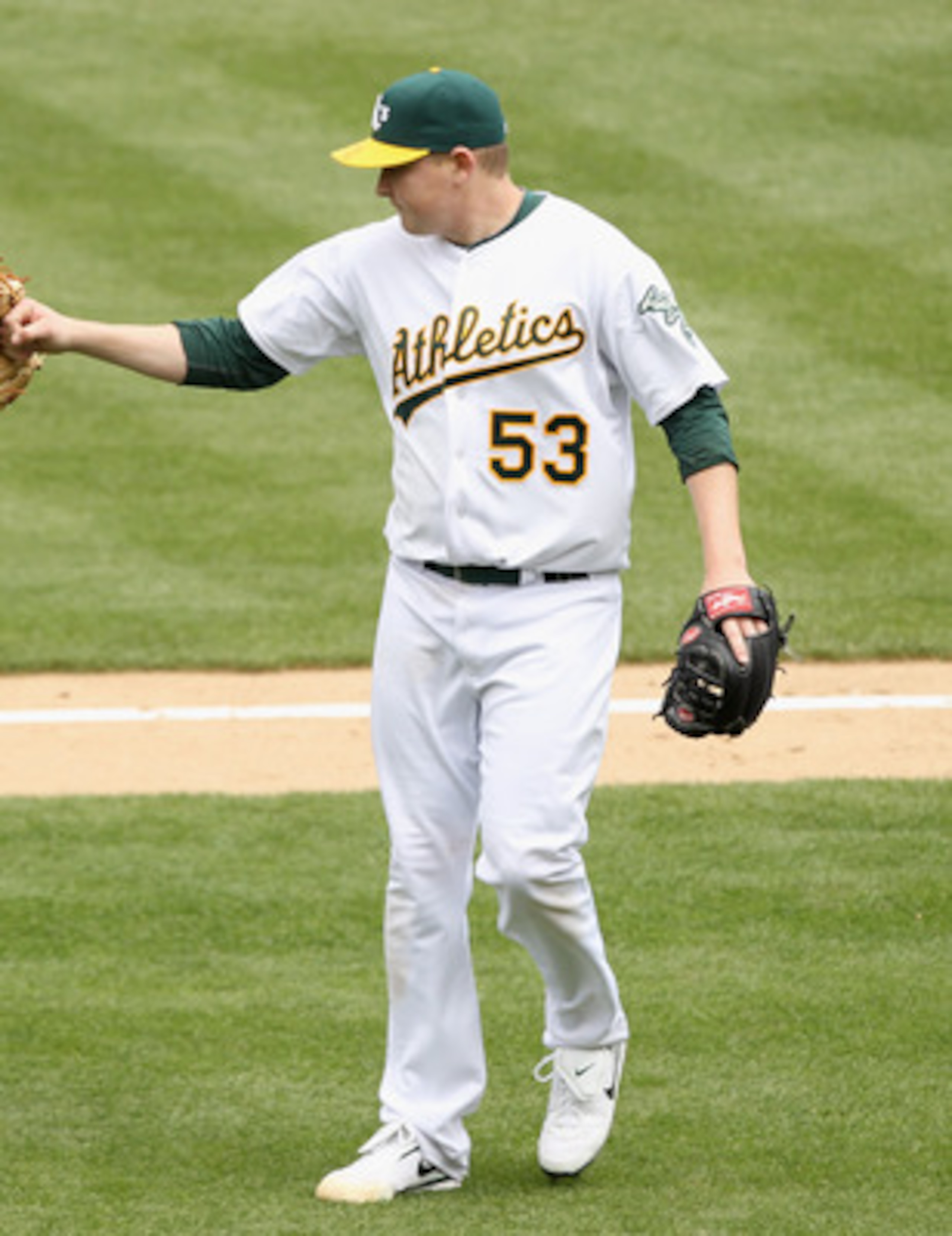 OAKLAND, CA - MAY 15:  Trevor Cahill #53 of the Oakland Athletics congratulates Mark Ellis #14 of the Oakland Athletics after he made a play to end the seventh inning against the Chicago White Sox at Oakland-Alameda County Coliseum on May 15, 2011 in Oakl