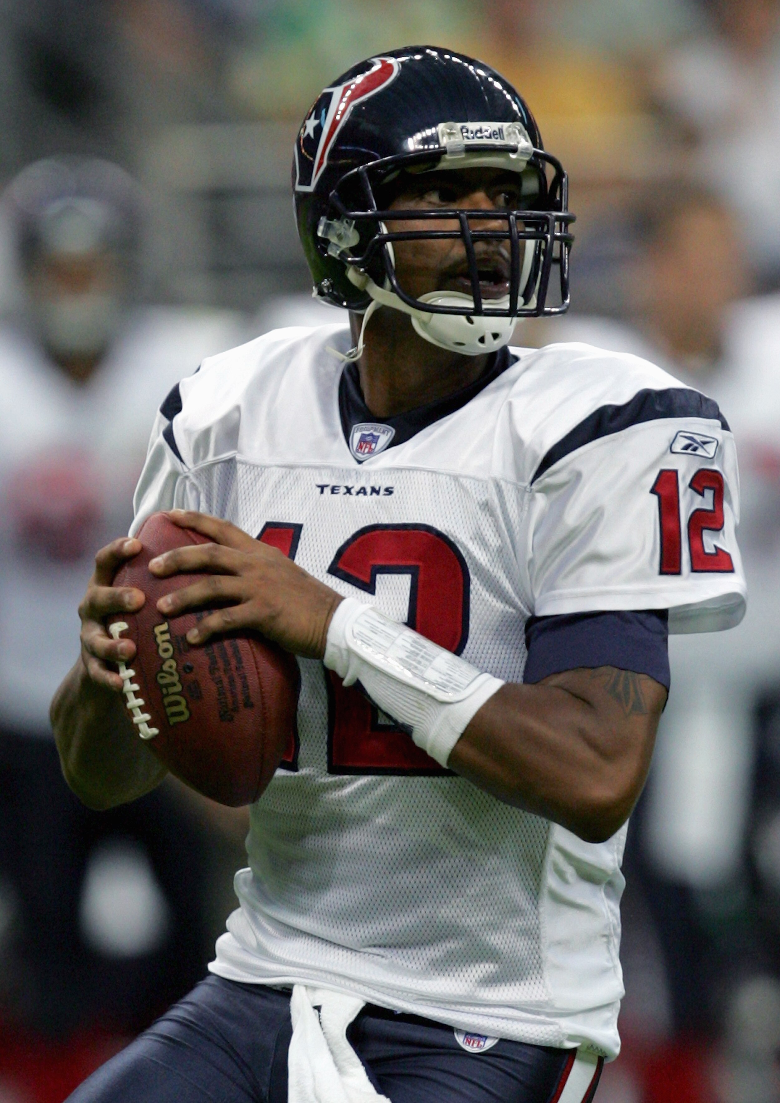 HOUSTON - AUGUST 13:  Quarterback Tony Banks #12 of the Houston Texans looks to pass against the Denver Broncos during the preseason game on August 13, 2005 at Reliant Stadium in Houston, Texas.  The Broncos defeated the Texans 20-14.  (Photo by Ronald Ma