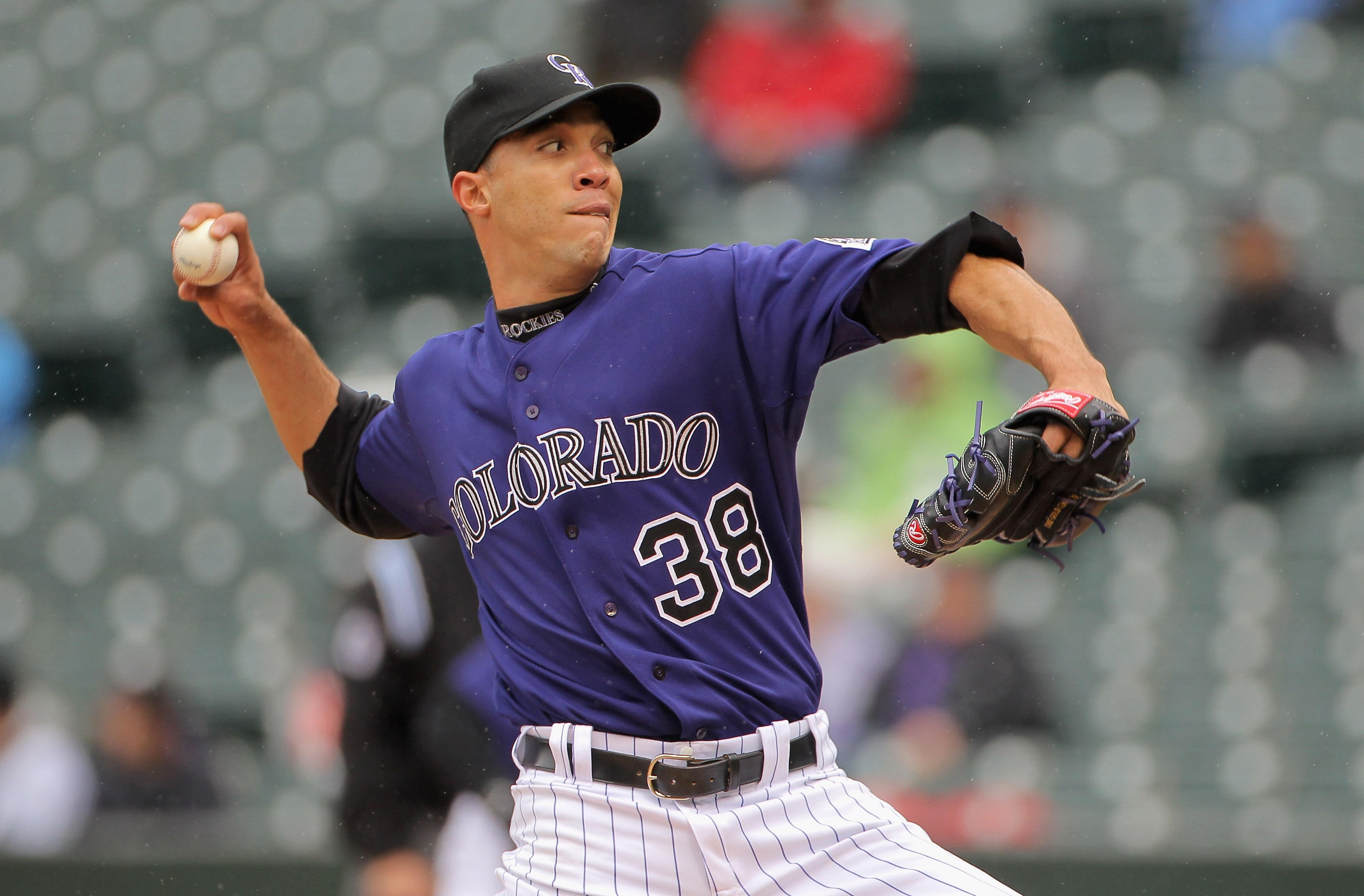 DENVER, CO - MAY 12:  Starting pitcher Ubaldo Jimenez #38 of the Colorado Rockies delivers against the New York Mets at Coors Field on May 12, 2011 in Denver, Colorado.  (Photo by Doug Pensinger/Getty Images)