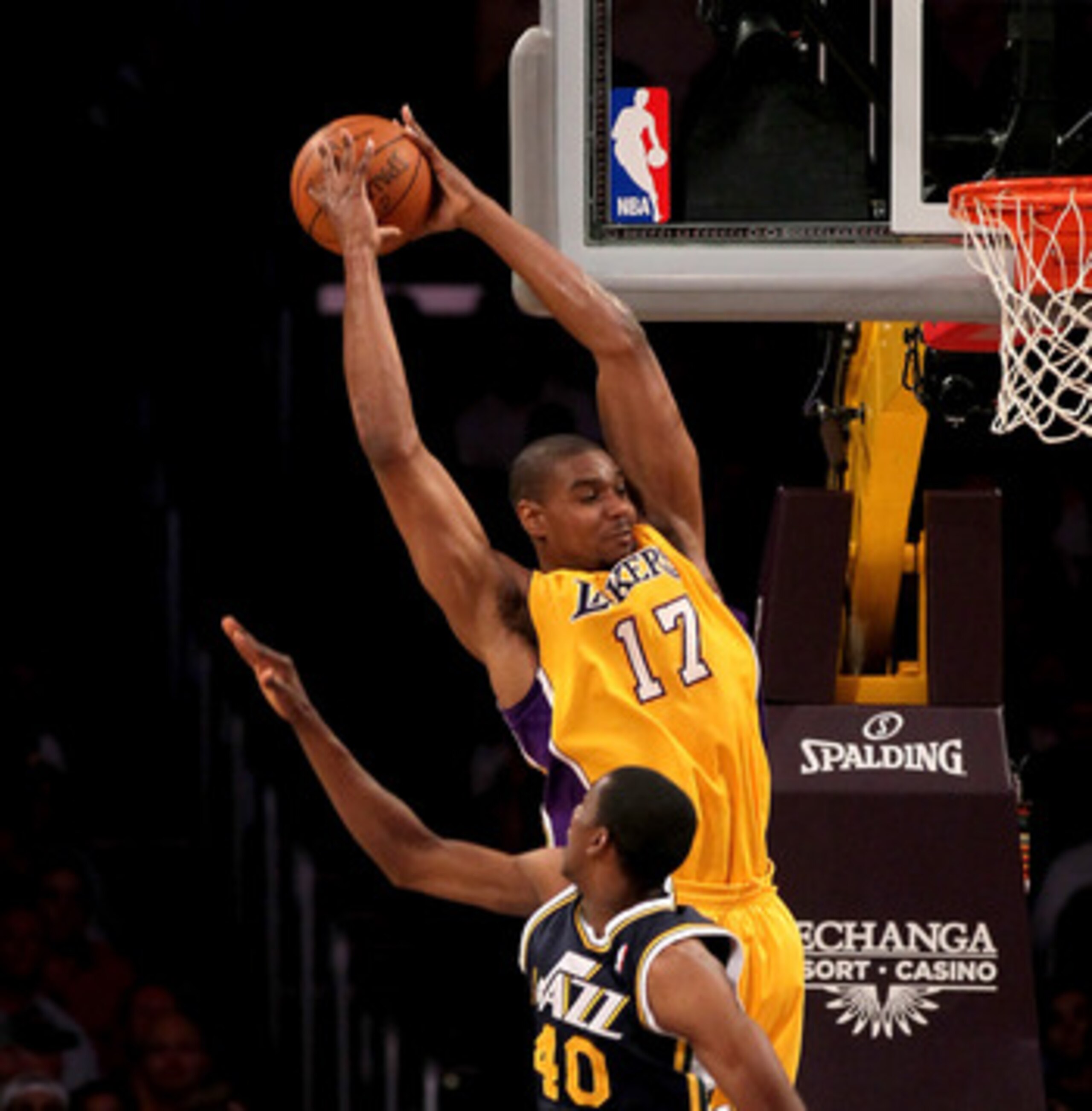 LOS ANGELES, CA - APRIL 5:  Andrew Bynum #17 of the Los Angeles Lakers jumps to catch a pass over Jeremy Evans #40 of the Utah Jazz at Staples Center on April 5, 2011 in Los Angeles, California.  NOTE TO USER: User expressly acknowledges and agrees that, 