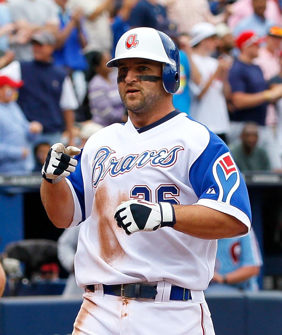 ATLANTA, GA - MAY 15:  Dan Uggla #26 of the Atlanta Braves reacts after hitting a solo homer in the eighth inning against the Philadelphia Phillies at Turner Field on May 15, 2011 in Atlanta, Georgia.  (Photo by Kevin C. Cox/Getty Images)