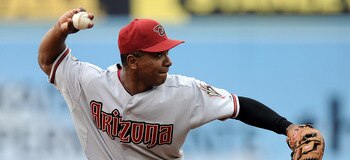 LOS ANGELES, CA - MAY 14:  Melvin Mora #4 of the Arizona Diamondbacks makes a thorw to first base for an out against the Los Angeles Dodgers at Dodger Stadium on May 14, 2011 in Los Angeles, California.  (Photo by Harry How/Getty Images)