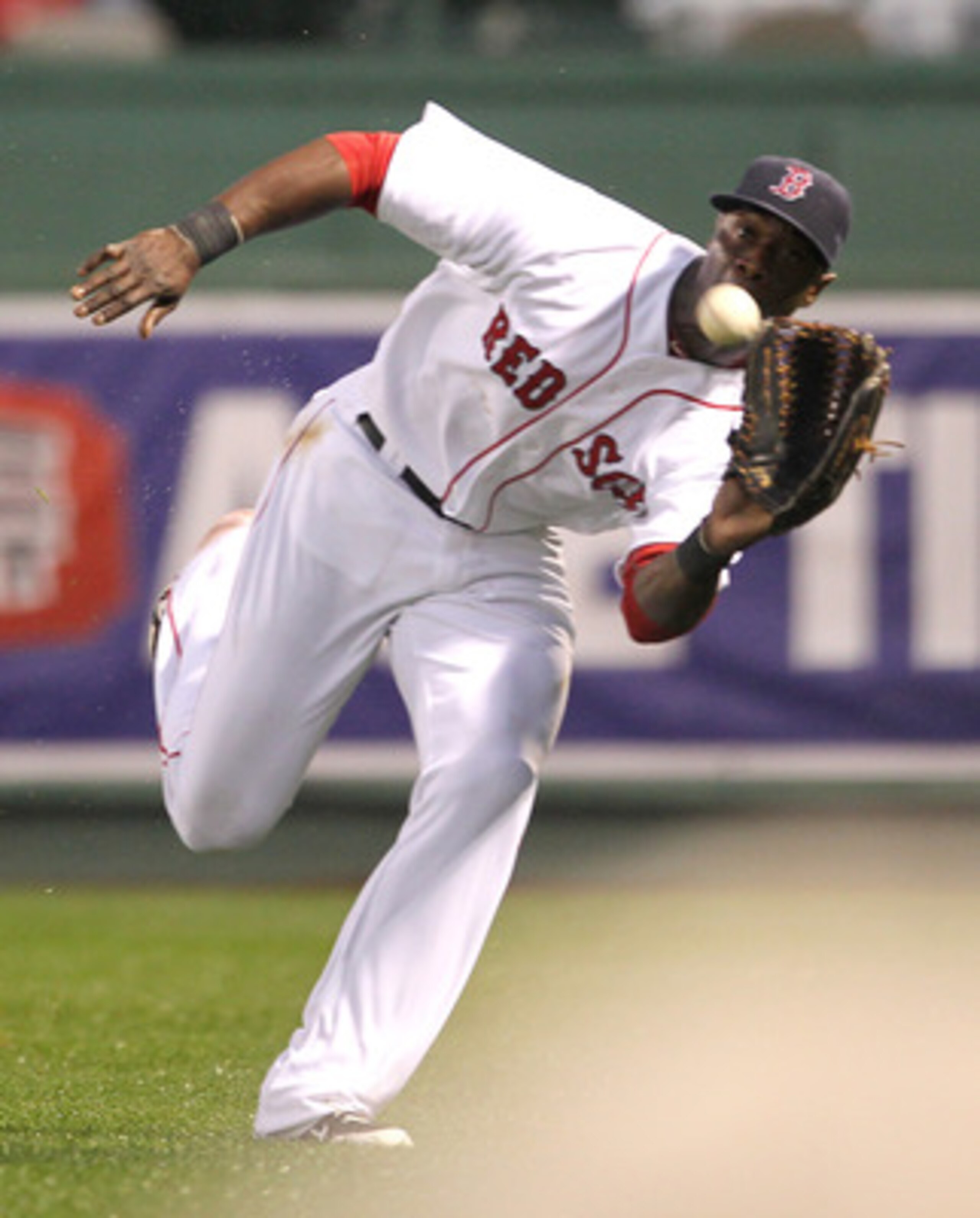 BOSTON, MA - MAY 4:  Mike Cameron #23 of the Boston Red Sox catches a line drive against the Los Angeles Angels of Anaheim at Fenway Park on May 4, 2011 in Boston, Massachusetts. (Photo by Jim Rogash/Getty Images)