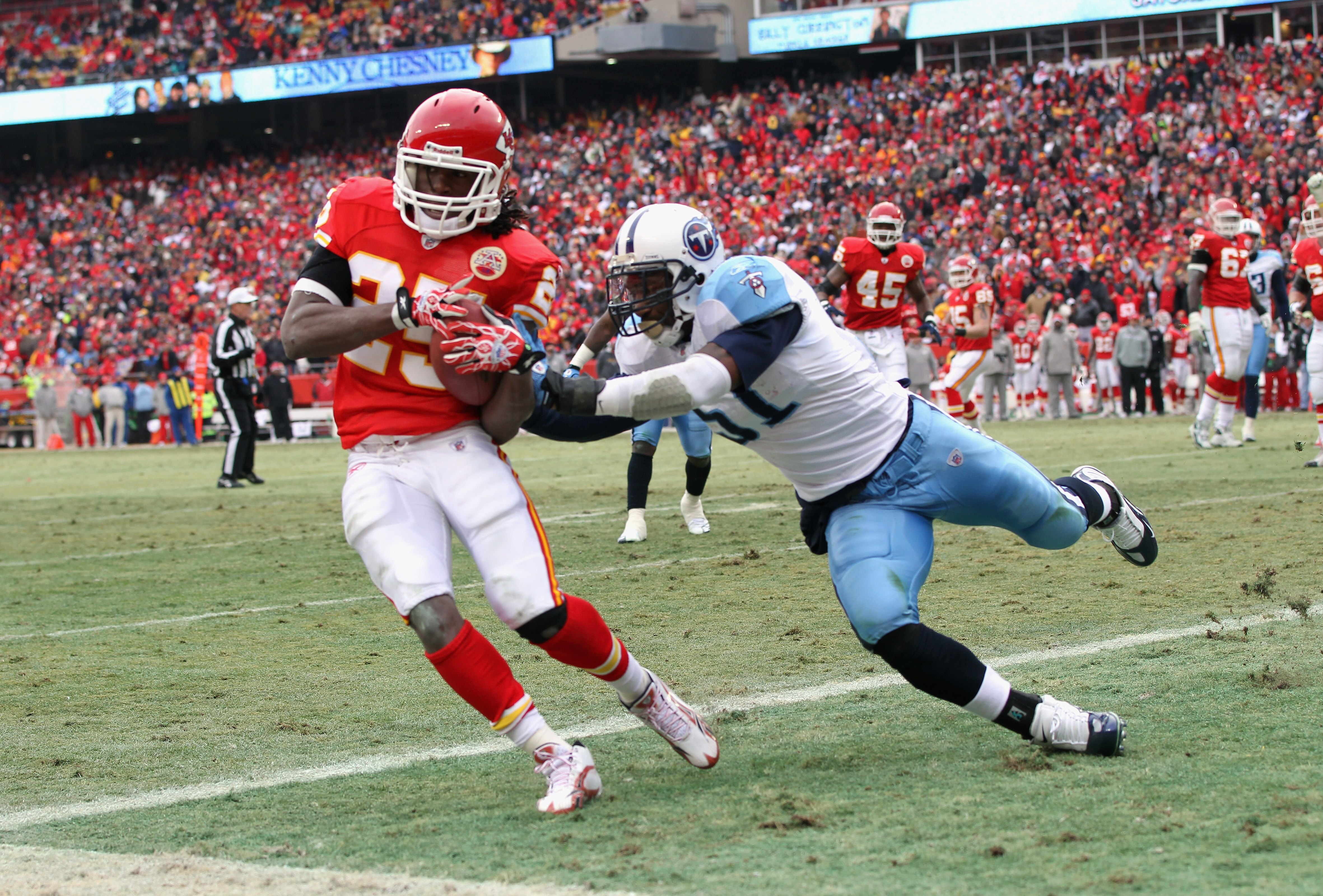 KANSAS CITY, MO - DECEMBER 26:  Jamaal Charles #25 of the Kansas City Chiefs makes a catch in the endzone for a touchdown as Gerald McRath #51 of the Tennessee Titans defends during the game on December 26, 2010 at Arrowhead Stadium in Kansas City, Missou