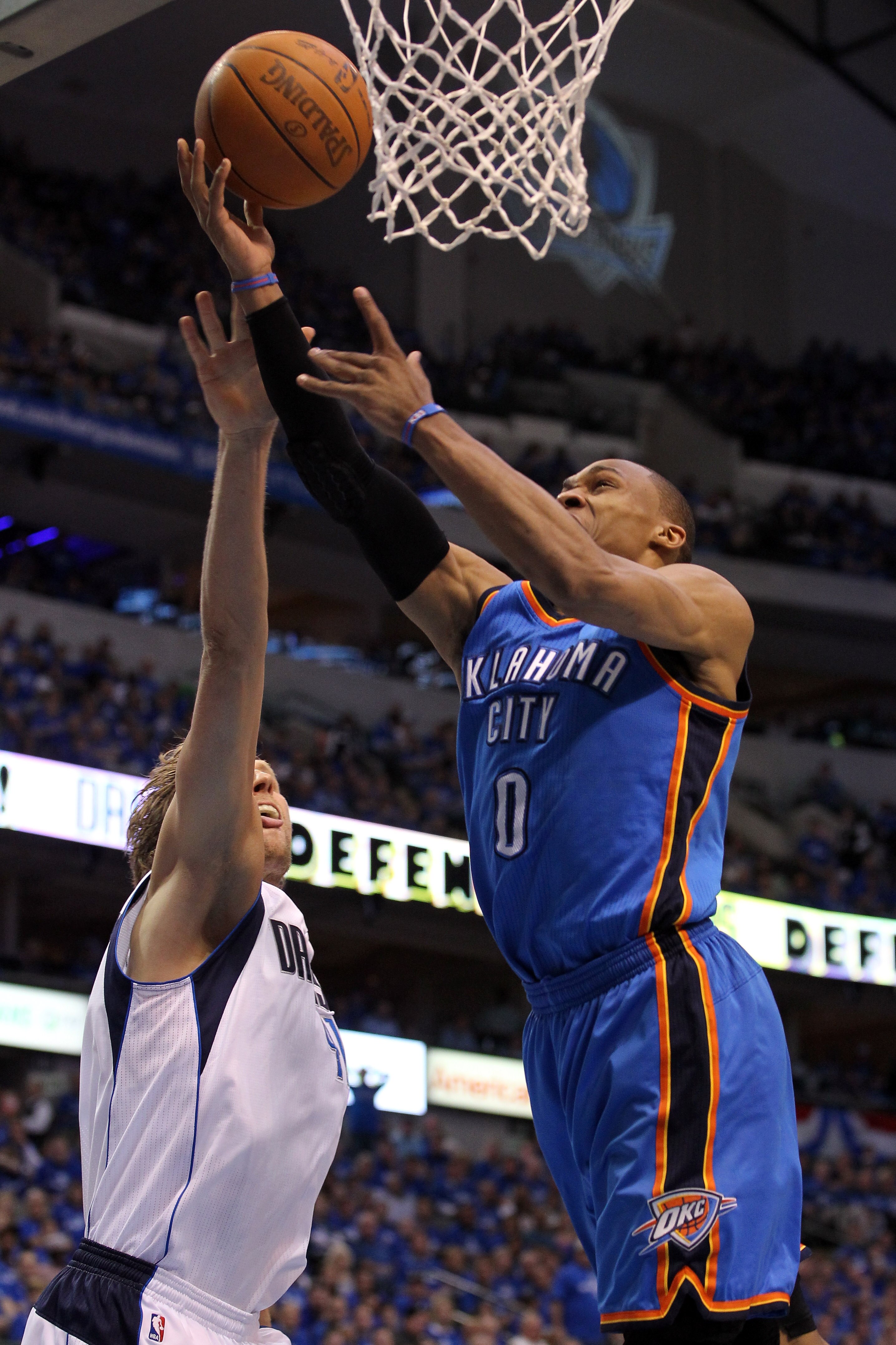 DALLAS, TX - MAY 17: Russell Westbrook #0 of the Oklahoma City Thunder goes up for a layup against Dirk Nowitzki #41 of the Dallas Mavericks in the third quarter in Game One of the Western Conference Finals during the 2011 NBA Playoffs at American Airlin DALLAS, TX - MAY 17: Russell Westbrook #0 of the Oklahoma City Thunder goes up for a layup against Dirk Nowitzki #41 of the Dallas Mavericks in the third quarter in Game One of the Western Conference Finals during the 2011 NBA Playoffs at American Airlin
