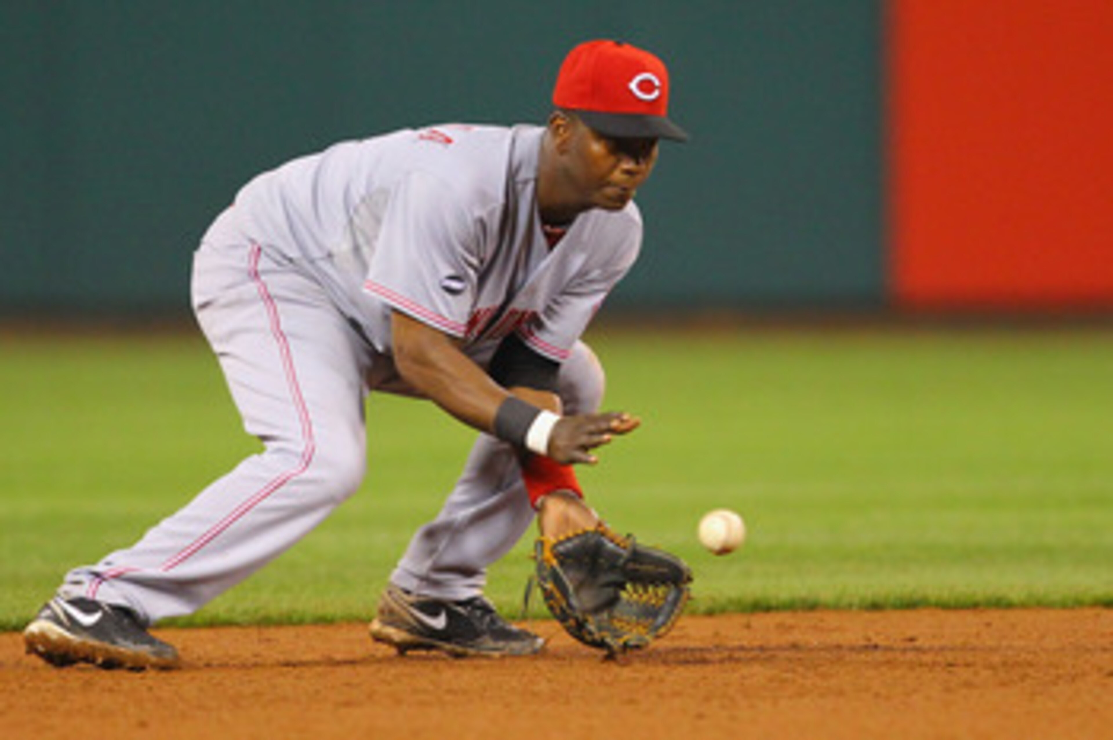 ST. LOUIS, MO - APRIL 22: Edgar Renteria #16 of the Cincinnati Reds fields a ground ball against the St. Louis Cardinals at Busch Stadium on April 22, 2011 in St. Louis, Missouri.  (Photo by Dilip Vishwanat/Getty Images)