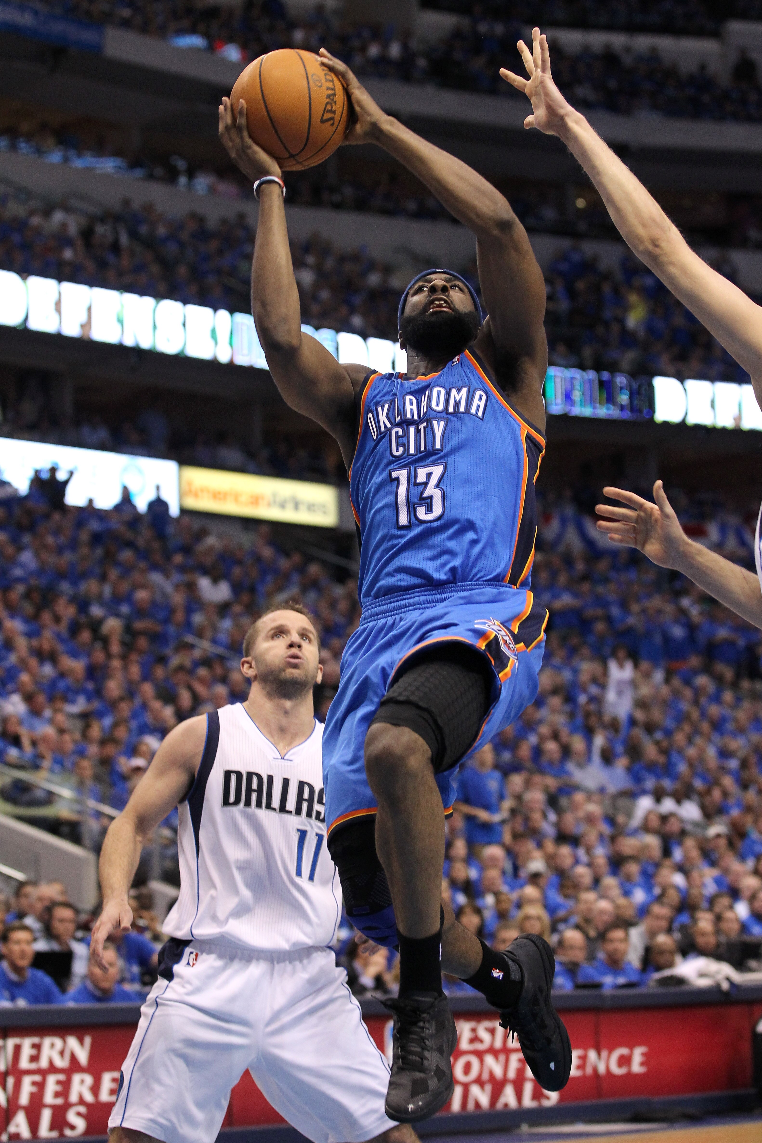 DALLAS, TX - MAY 17: James Harden #13 of the Oklahoma City Thunder goes up for a shot in front of Jose Juan Barea #11 of the Dallas Mavericks in the fourth quarter in Game One of the Western Conference Finals during the 2011 NBA Playoffs at American Airl DALLAS, TX - MAY 17: James Harden #13 of the Oklahoma City Thunder goes up for a shot in front of Jose Juan Barea #11 of the Dallas Mavericks in the fourth quarter in Game One of the Western Conference Finals during the 2011 NBA Playoffs at American Airl