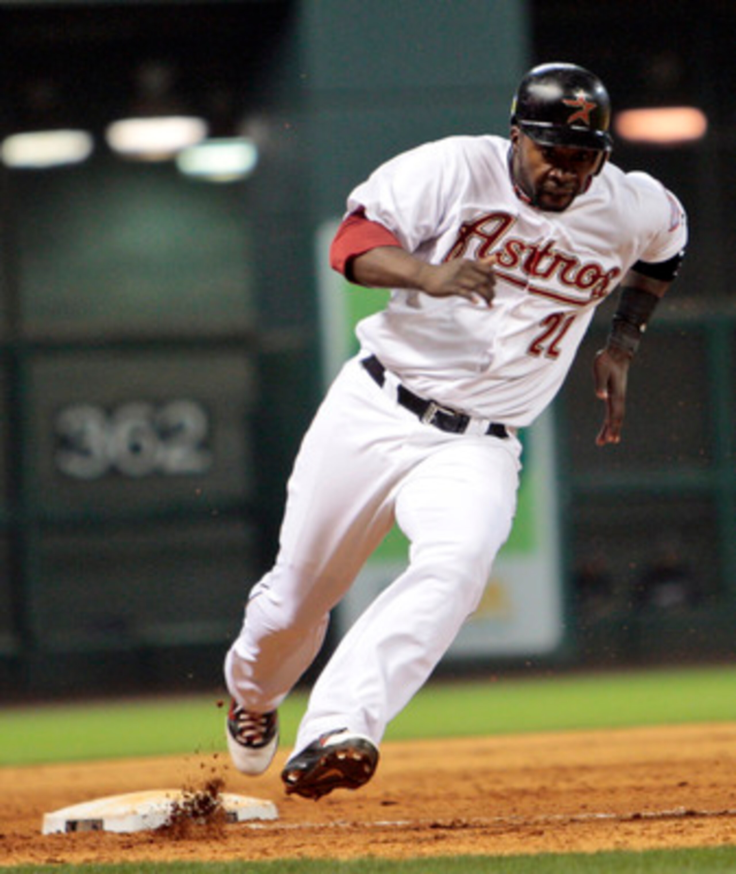 HOUSTON - APRIL 30:  Bill Hall #22 of the Houston Astros rounds third base to score on a singe by Jason Bourgeois in the bottom of the ninth inning to defeat the Milwaukee Brewers 2-1 at Minute Maid Park on April 30, 2011 in Houston, Texas.  (Photo by Bob